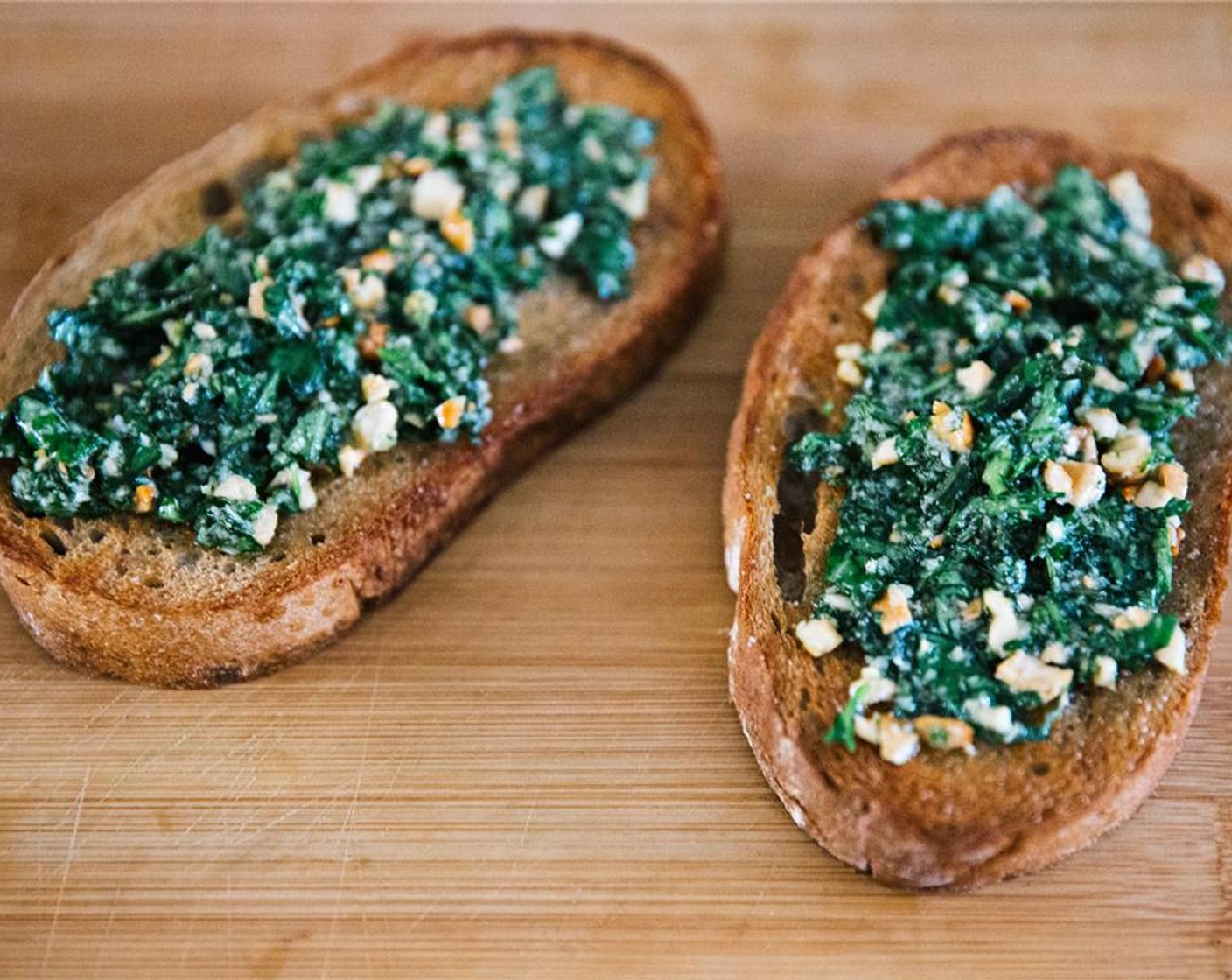 step 10 Spread one side of toast with pesto.