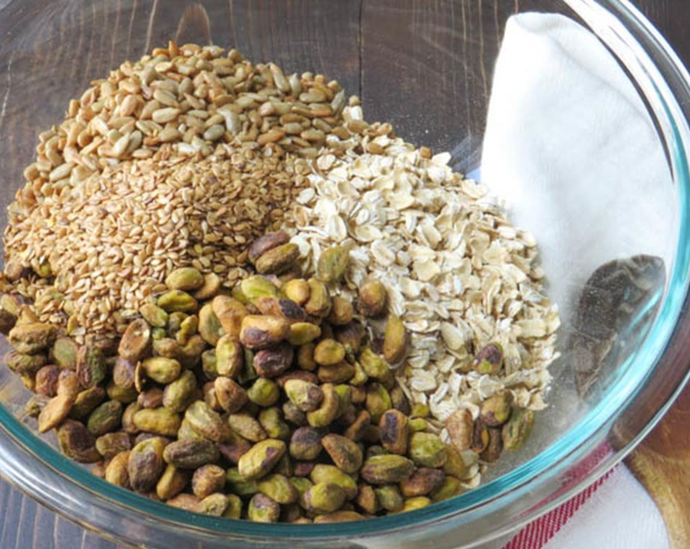 step 2 In a large bowl combine the Old Fashioned Rolled Oats (2 1/2 cups), Roasted Shelled Pistachios (1 cup), Sunflower Seeds (1/2 cup), Flaxseeds (2 Tbsp), Sweetened Coconut Flakes (1 cup) and Kosher Salt (1/2 tsp). Mix well and set aside.