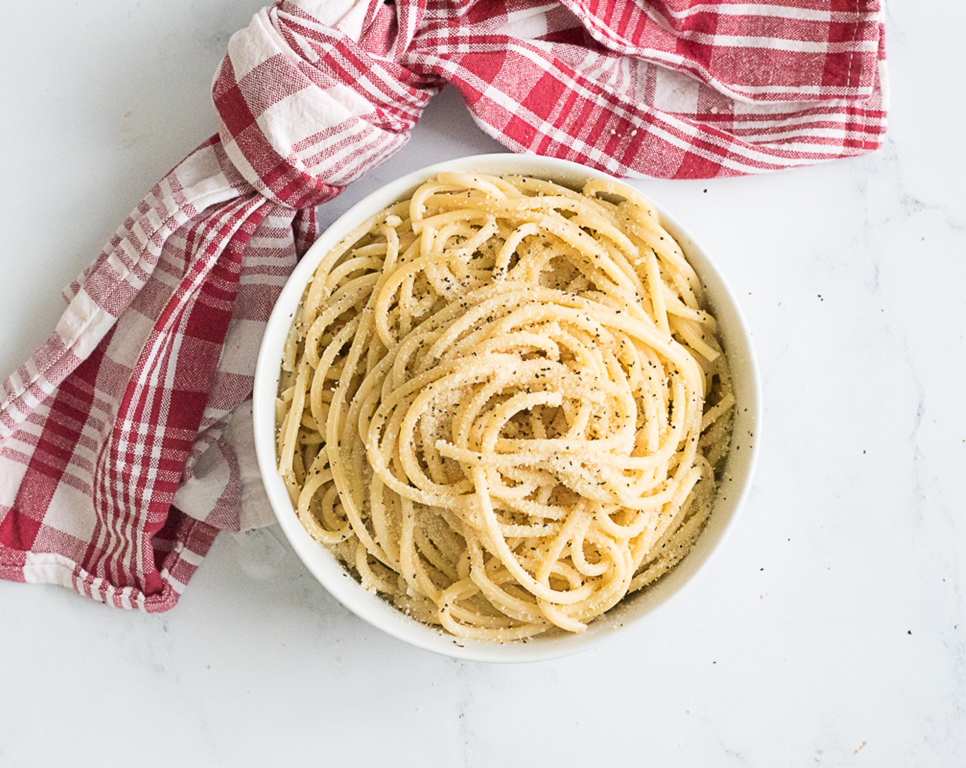 step 7 Plate the pasta and garnish with either shredded Parmesan cheese or more grated Parmesan cheese and serve.