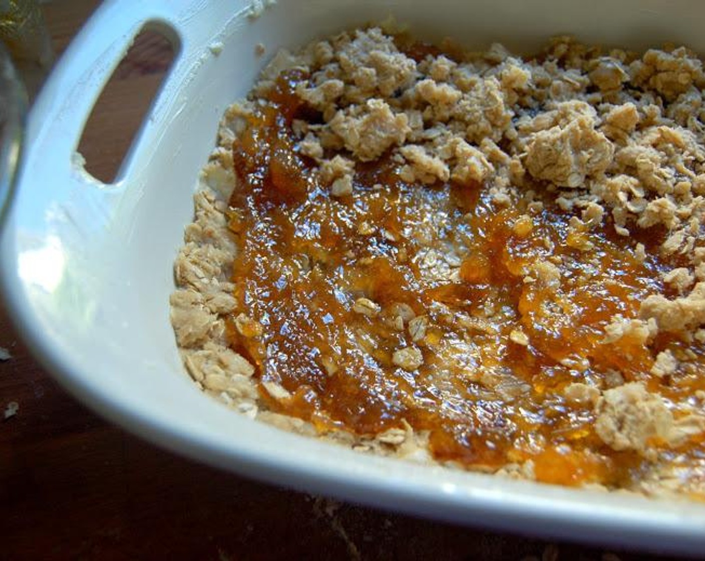 step 4 Press half of the mixture into the prepared pan. Spread an entire jar of Just Jan’s® Fruit Spread (1 jar) evenly on top of the crust.  Sprinkle the other half of the oat mixture on top of the fruit spread.