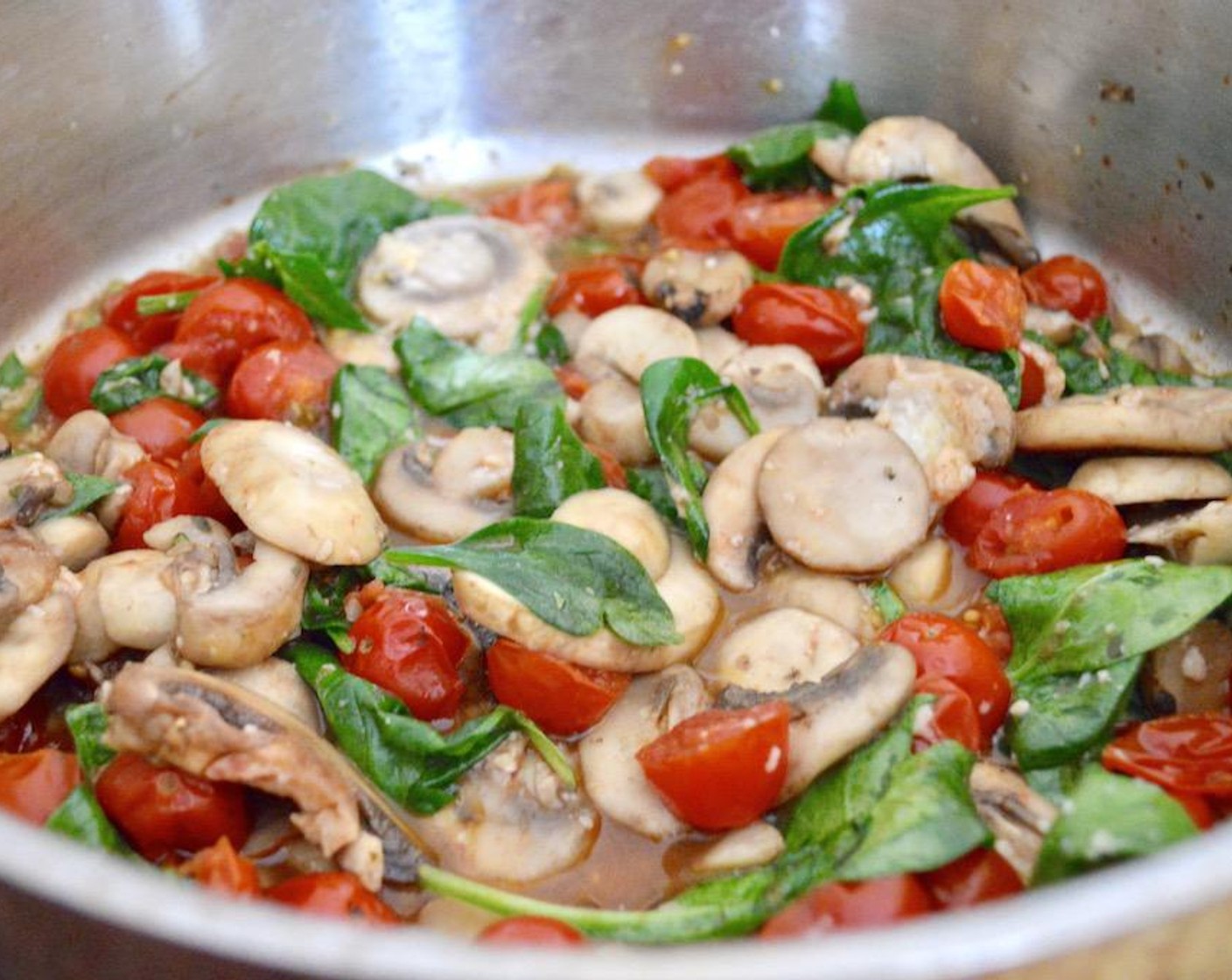 step 3 Then add in the Fresh Baby Spinach (1 cup) and let it just wilt in, followed by the seasoning of Salt (1 pinch), Freshly Ground Black Pepper (1 pinch), and McCormick® Garlic Powder (1 pinch). Finally, add the Grated Parmesan Cheese (1 Tbsp) to melt in. Stir it all together well and set it aside.