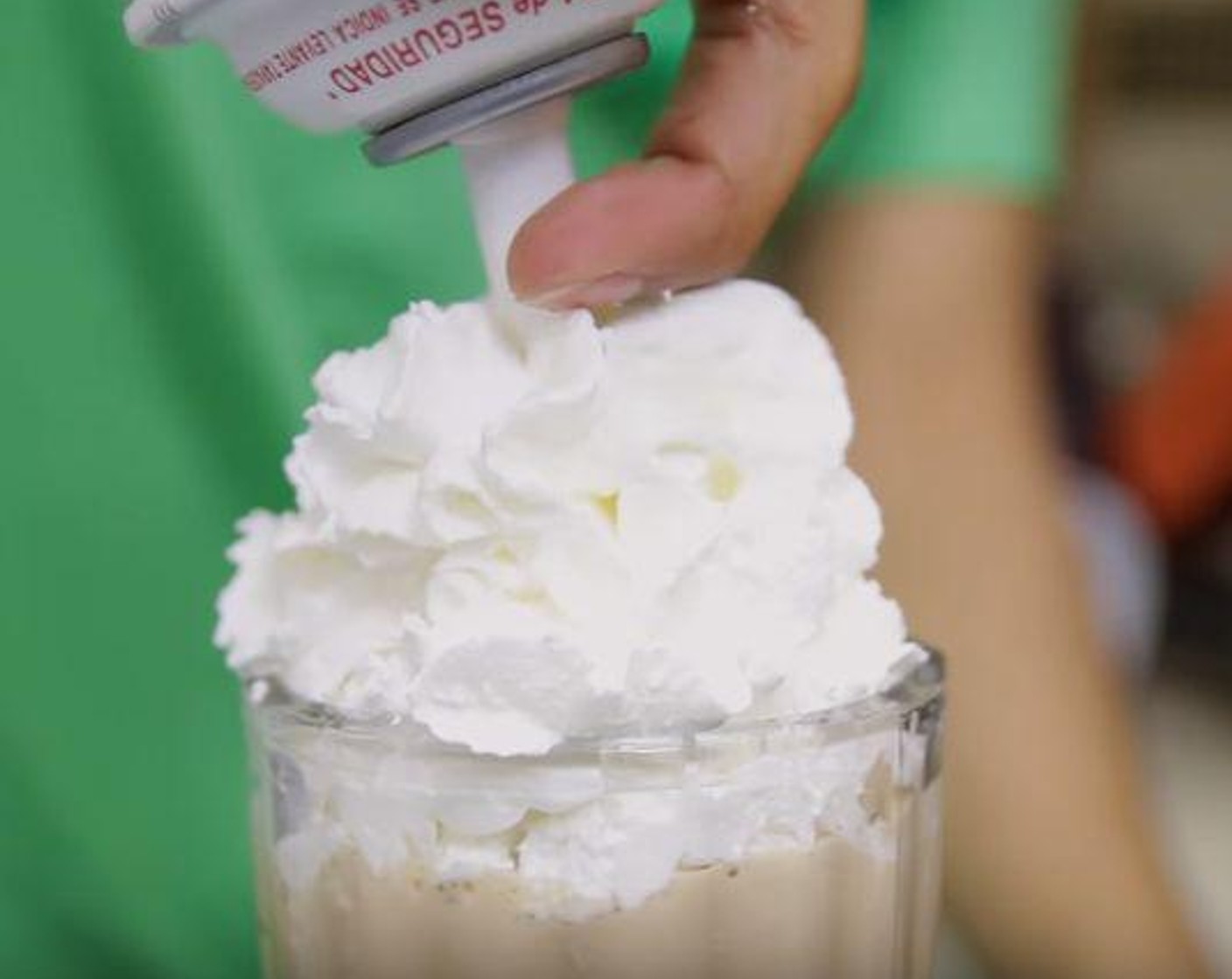 step 2 Pour in a glass, garnish with Whipped Cream (to taste) and drizzle with more chocolate sauce.