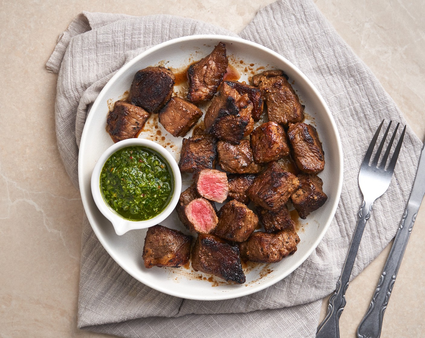 step 6 Serve the steak bites with chimichurri sauce.