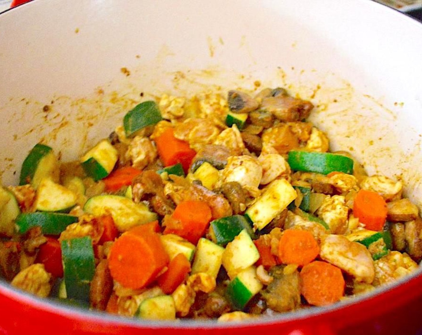 step 2 Add the Boneless Skinless Chicken (1 lb) and let it cook thoroughly with the vegetables. While it cooks, season it with the Curry Powder (1 1/2 Tbsp), Salt (1 pinch) and Freshly Ground Black Pepper (1 pinch).