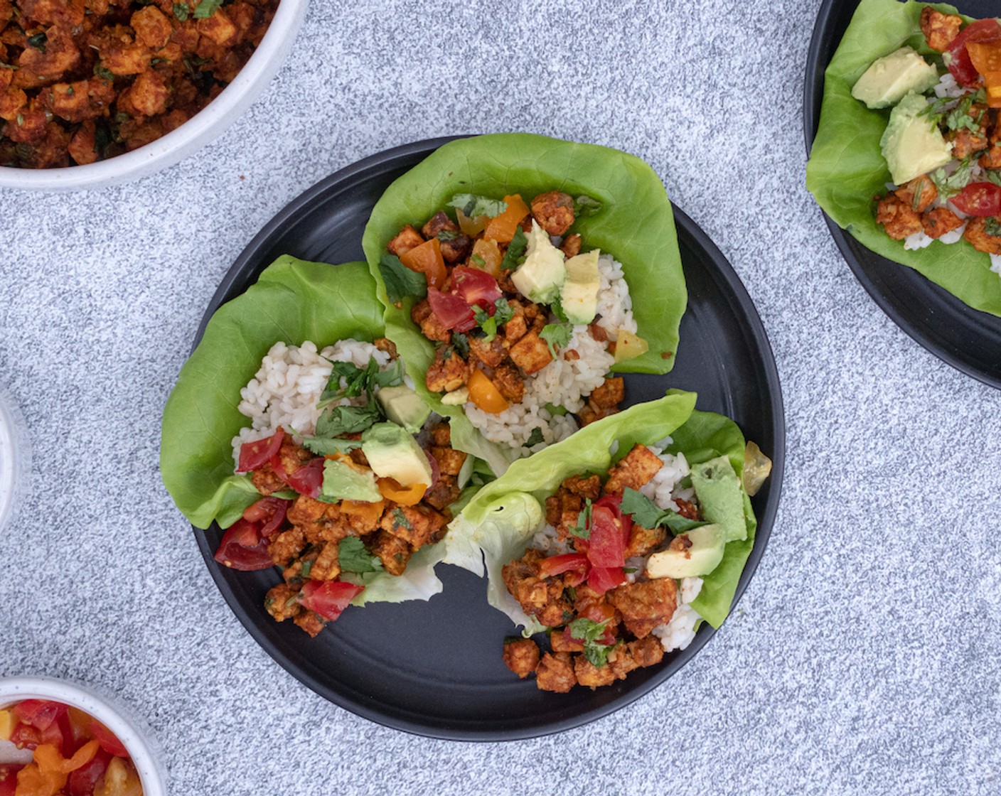 step 8 Evenly divide rice and tempeh among 10 leaves of Butter Lettuce (1 head), topping each lettuce cup with Cherry Tomato (1 cup), Avocados (to taste) slices or cubes, and remaining ¼ cup cilantro. Enjoy!