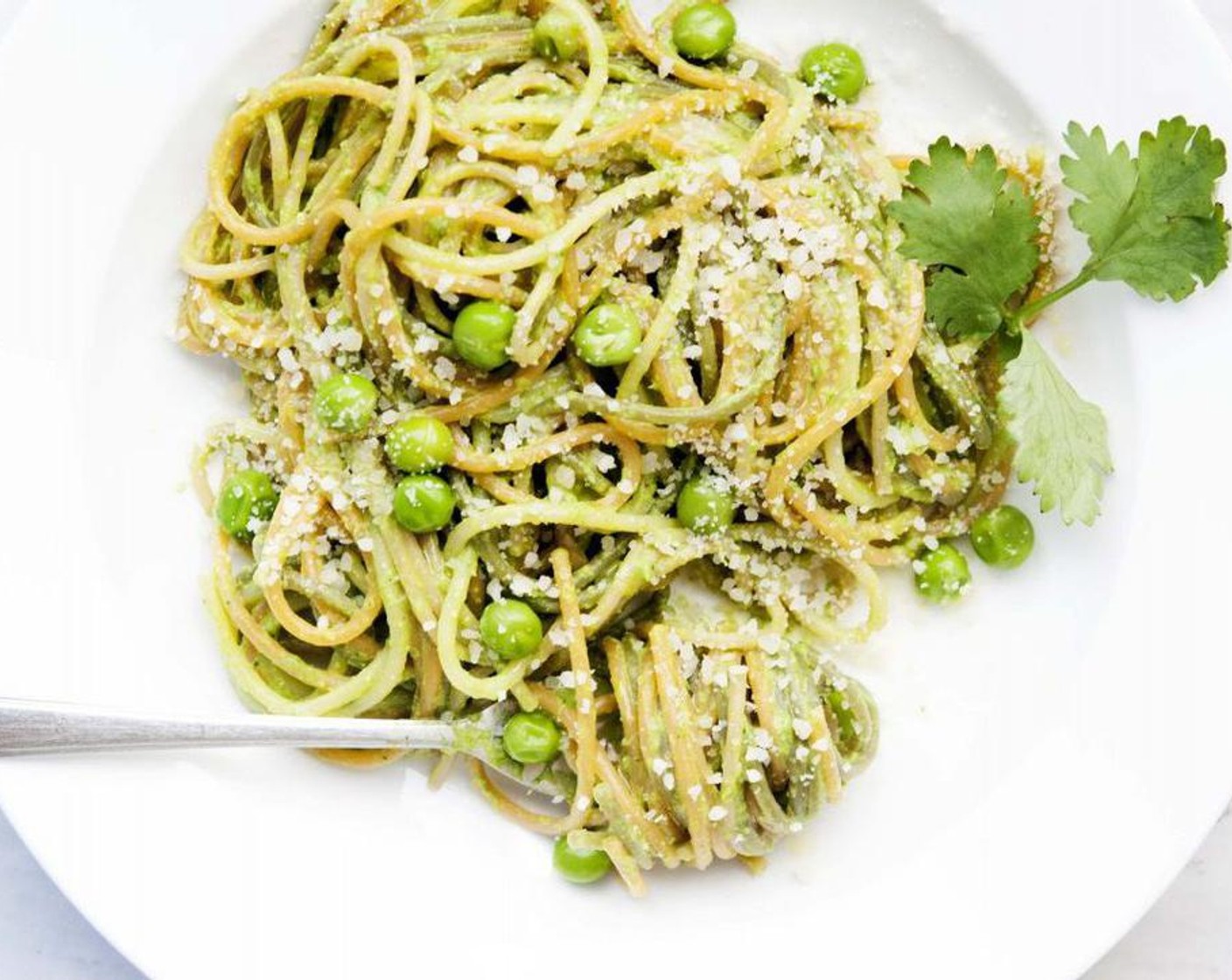 step 5 Serve pasta with more Parmesan, a drizzle of oil and a few whole peas.