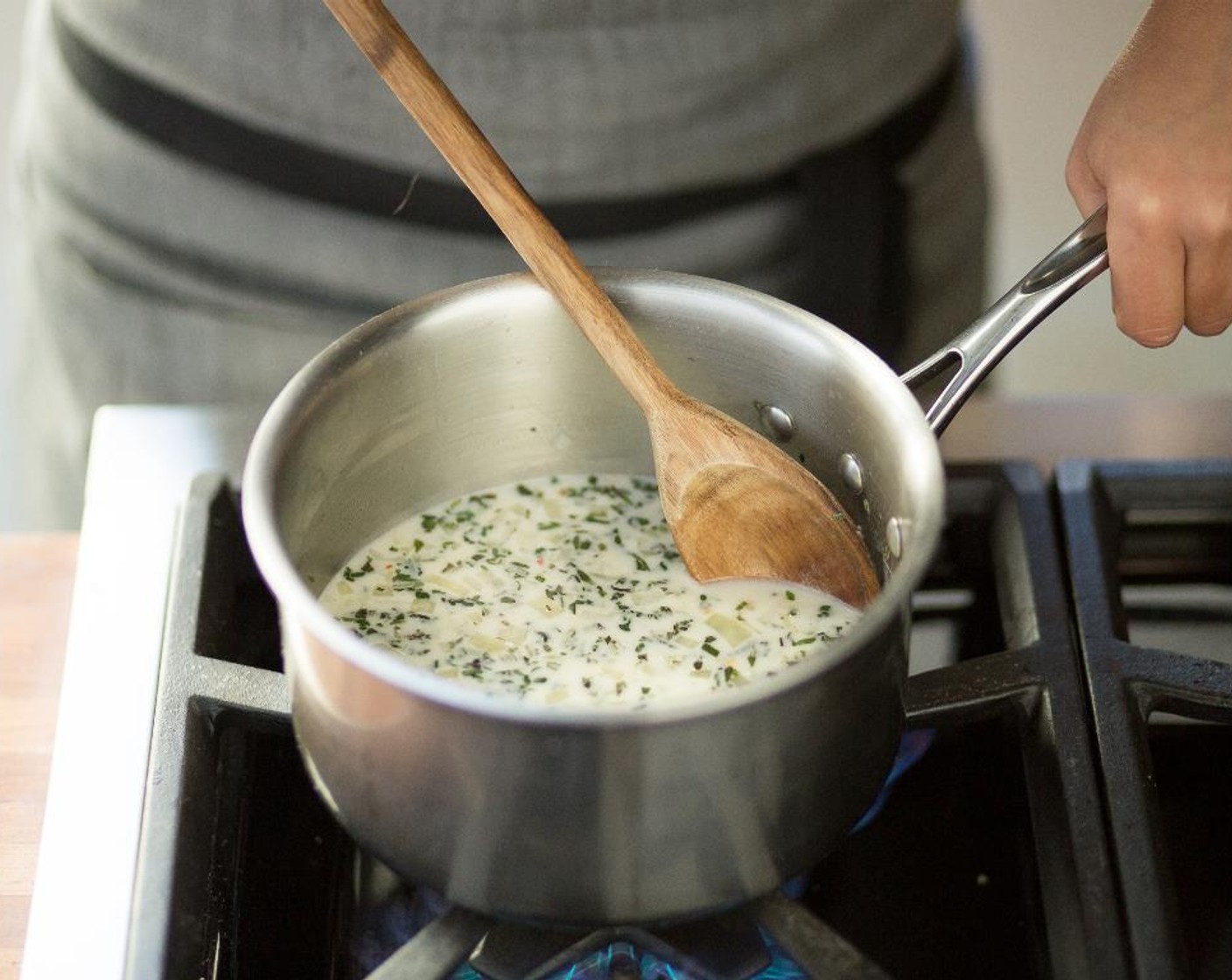 step 8 Add chicken broth, Kemps Heavy Whipping Cream (4 Tbsp), and bring to a boil.