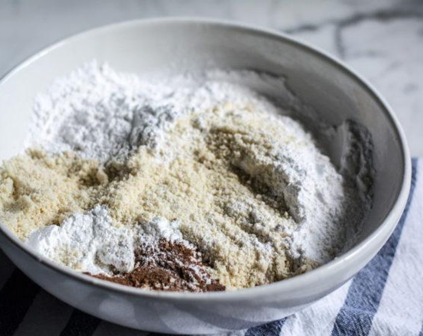 step 2 Add Almond Flour (3 cups), Tapioca Starch (1 cup), Baking Powder (1/2 Tbsp), Ground Cinnamon (1 tsp) and Sea Salt (1/8 tsp), to a medium bowl, whisk to combine and set aside.