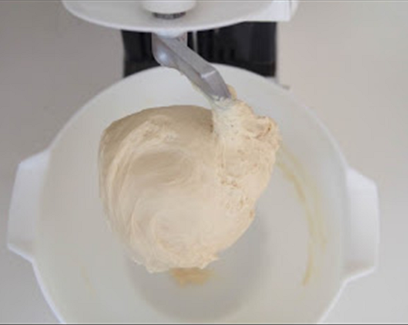 step 3 Put Salt (1/2 tsp), High-Gluten Bread Flour (2 1/3 cups), Instant Dry Yeast (1 tsp), Brown Sugar (2 Tbsp), Butter (0.5 oz), white from Farmhouse Eggs® Large Brown Egg (1) and the cooked sticky rice mixture into the bowl of stand mixer. Using the dough hook attachment, knead on low speed until all ingredients have come together. Turn to medium speed and knead for about 20 minutes or until the dough become very sticky, smooth and elastic. If the dough is too wet, add 1 tablespoon of flour at a time.