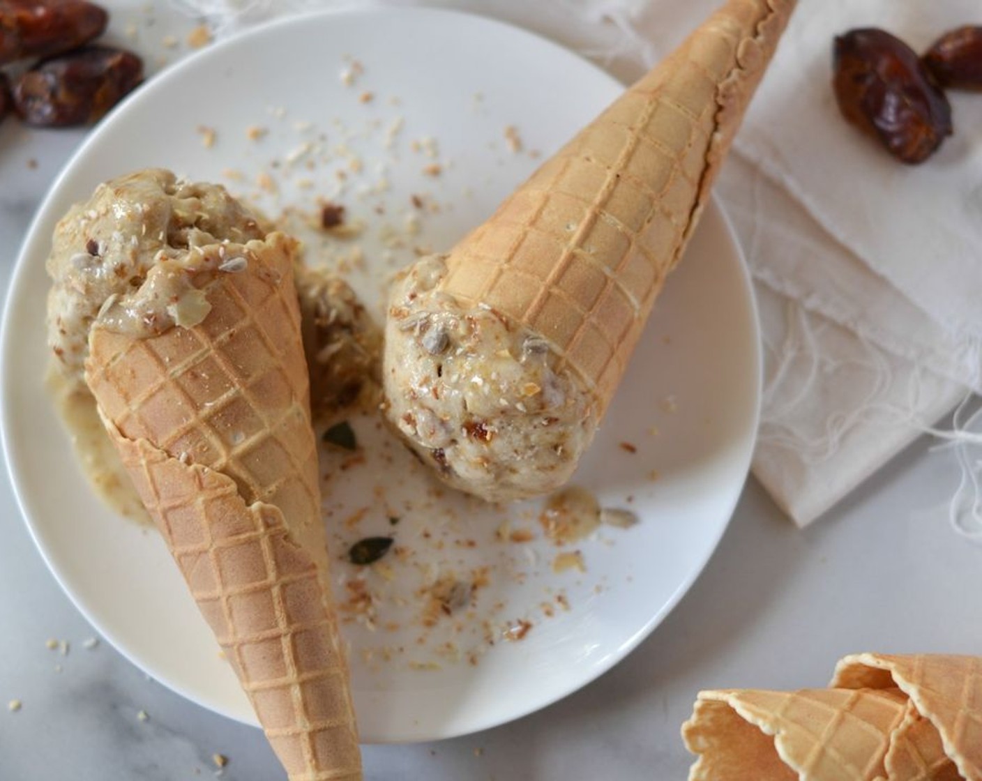 step 3 Blitz until smooth and serve the date “toffee” alongside the ice cream while its still warm. Scoop the ice cream into Ice Cream Cones (8), add a scatter of toasted Unsweetened Coconut Flakes (to taste), a spoonful of toffee sauce and serve immediately.