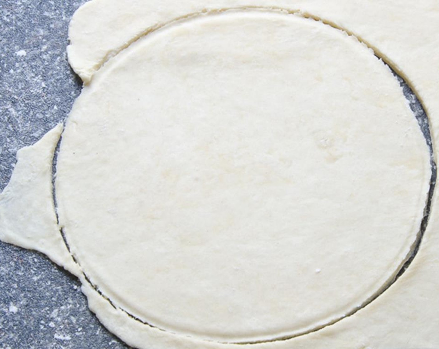 step 10 Cut the dough into 4 equal pieces. On a lightly floured work surface, roll out one piece of dough to 1/8-inch thick.