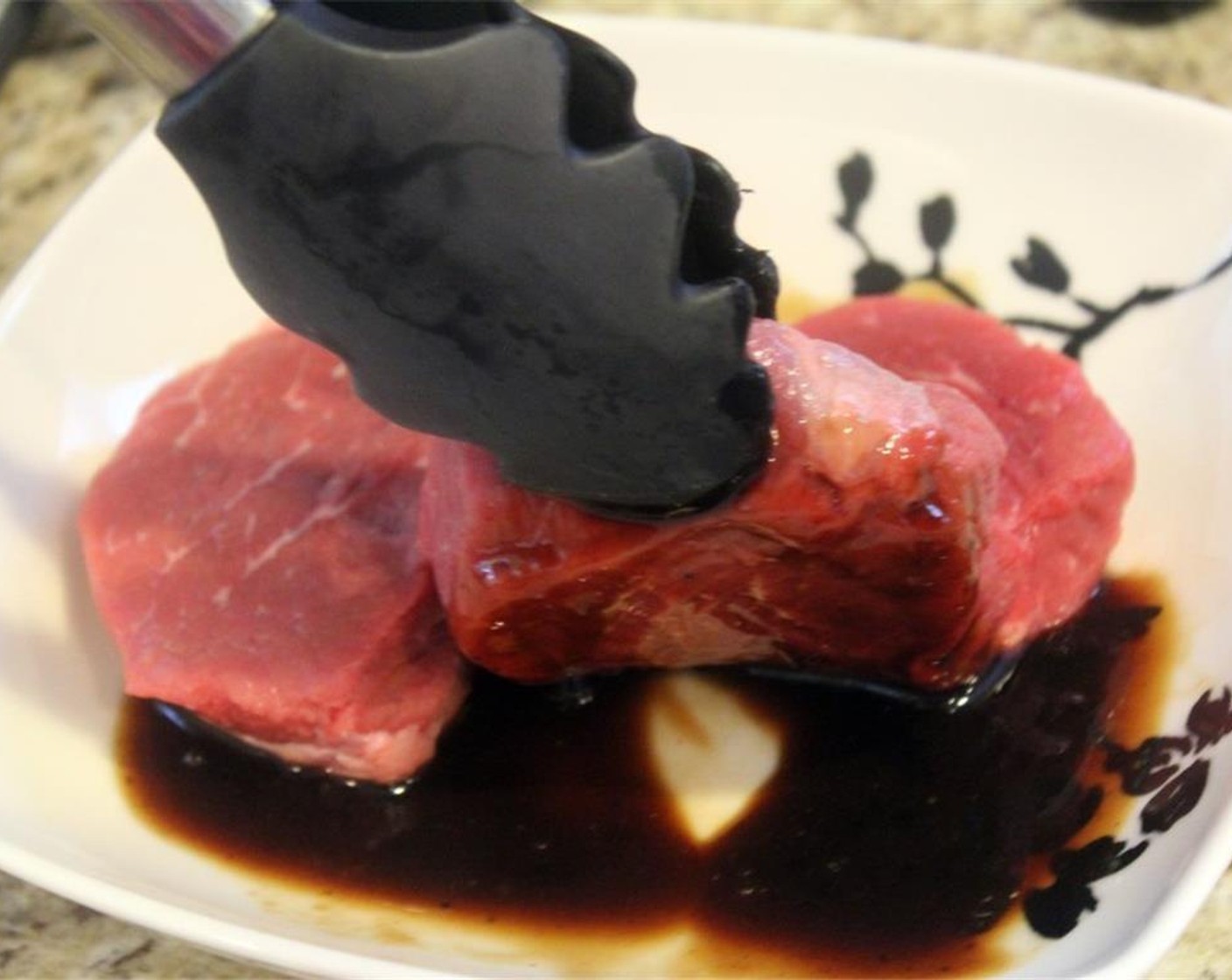 step 4 Dredge Steak (8 oz) back and forth to coat both sides.