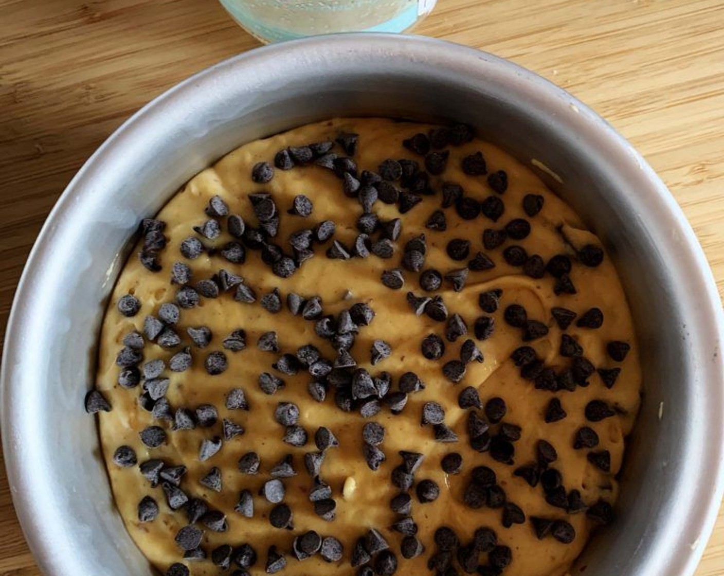 step 7 Pour the batter into a greased pan and top it off with some extra chocolate chips.