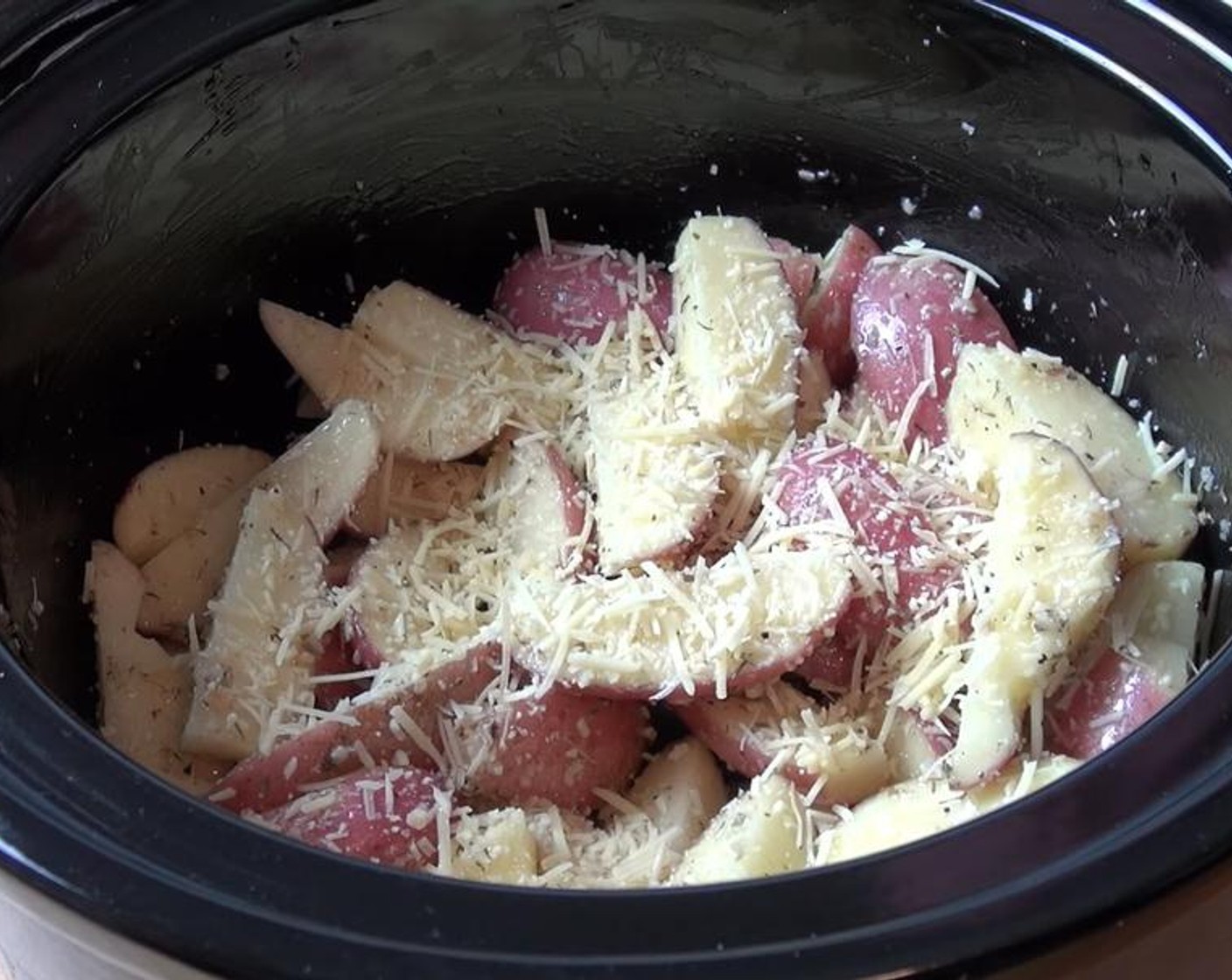 step 3 Pour the oil mixture over the potatoes. Stir together. Sprinkle with Parmesan Cheese (1/4 cup).