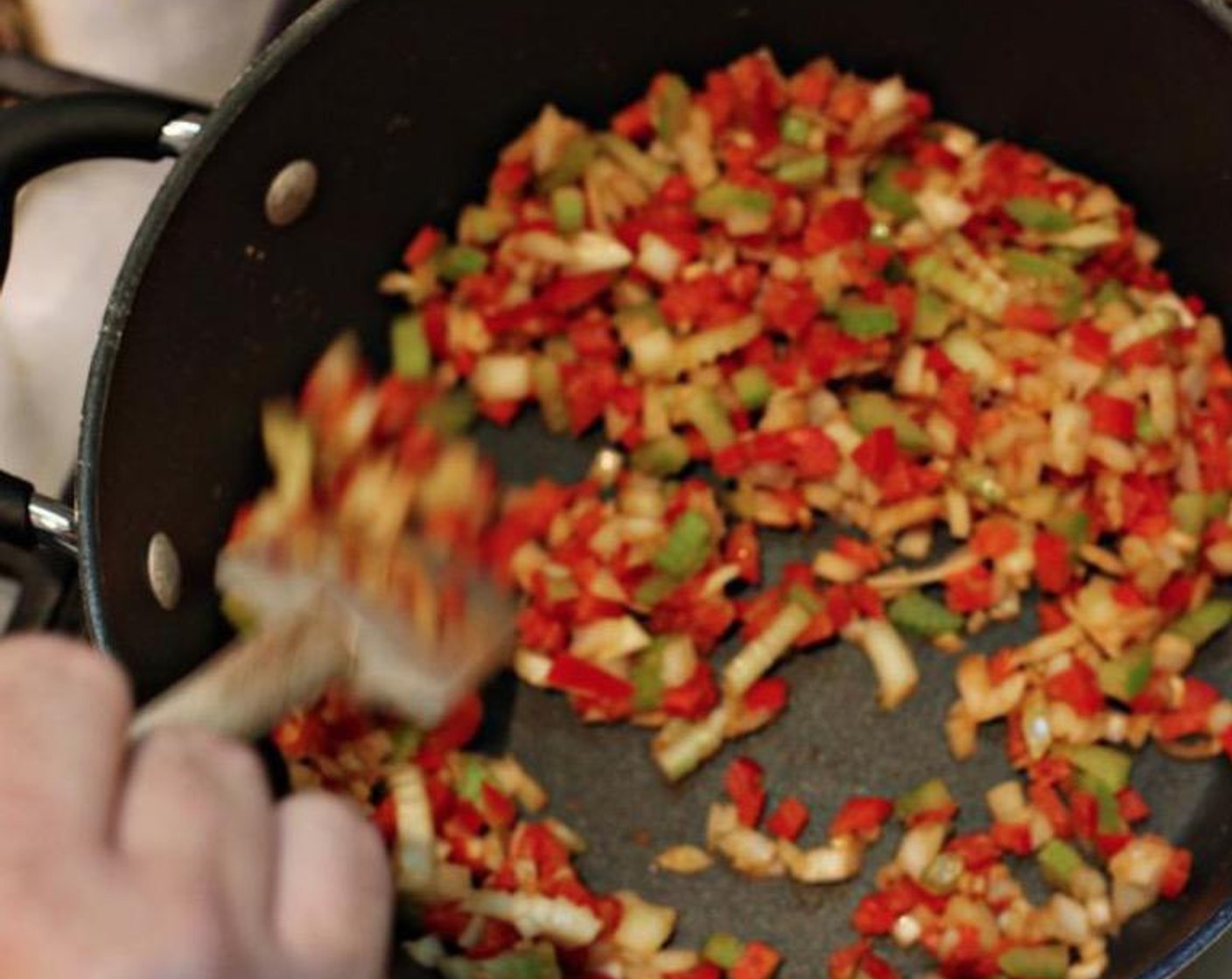 step 5 Add the Cajun Seasoning (to taste), the diced yellow onion, celery, pepper and garlic to the roux. Cook 4-5 minutes, while stirring continuously.