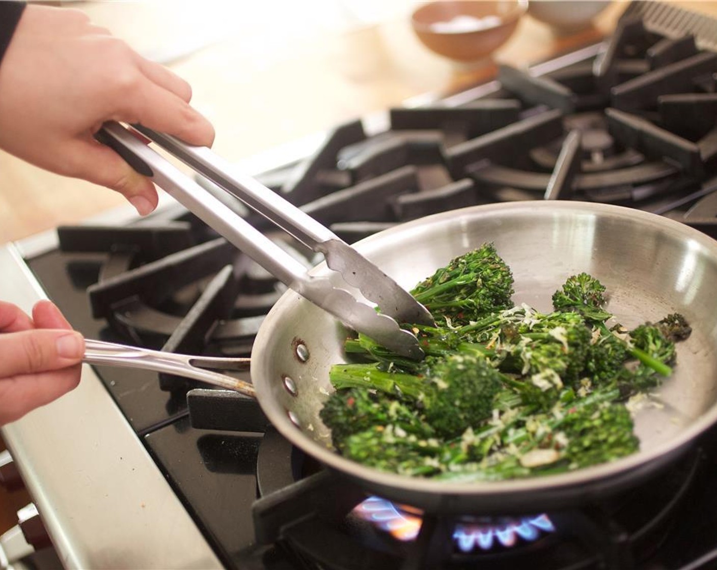 step 8 Heat two tablespoons of olive oil in a large saute pan over medium heat. Place the Broccolini (1 3/4 cups), Salt (1/4 tsp), and Black Pepper (1/4 teaspoon), and cook for four to five minutes.