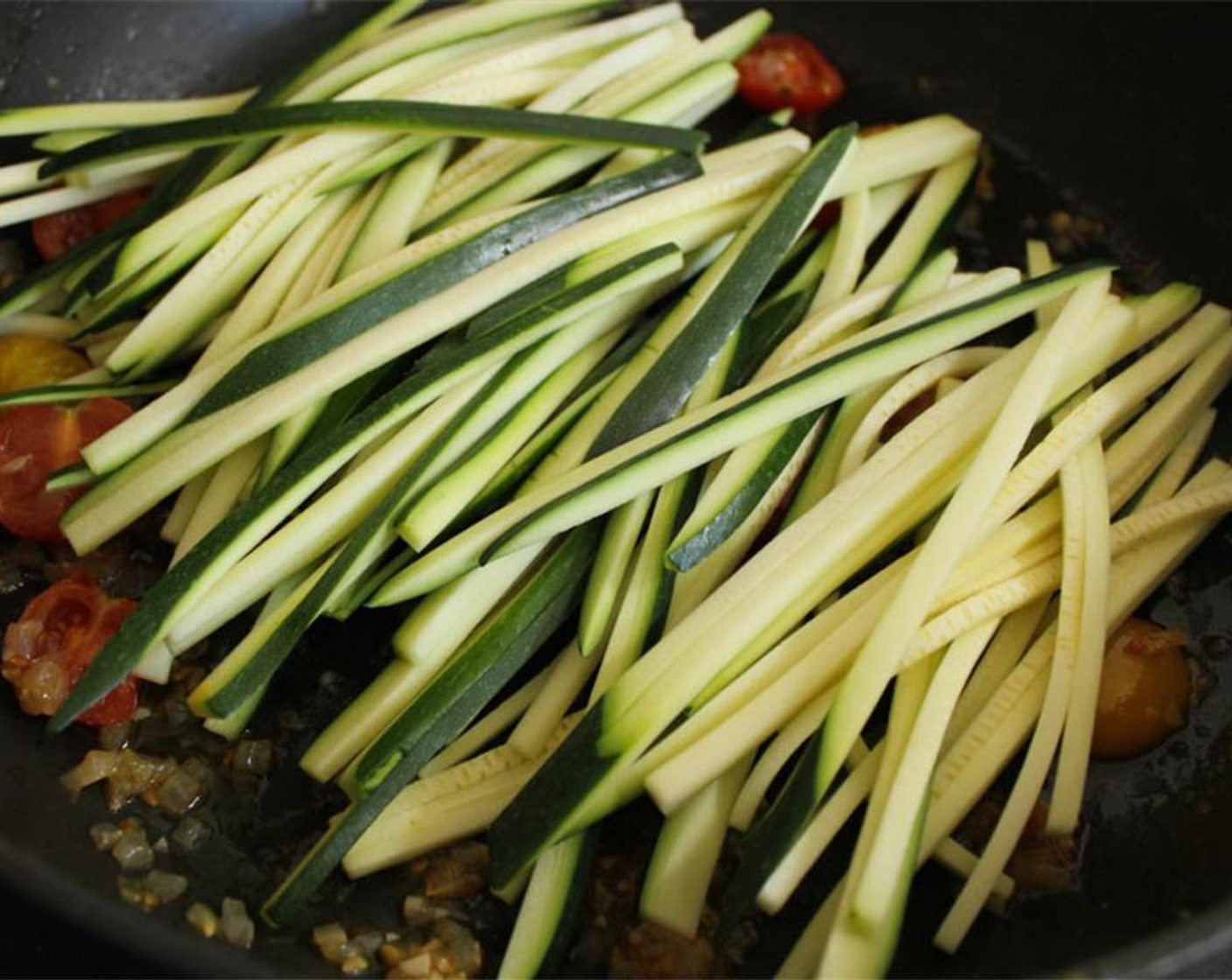 step 12 Add the zucchini ribbons to the tomatoes and sauté for 2-3 minutes until the “pasta” is just tender, and then remove it from the heat immediately. You want the zucchini to be “al dente” not mushy.