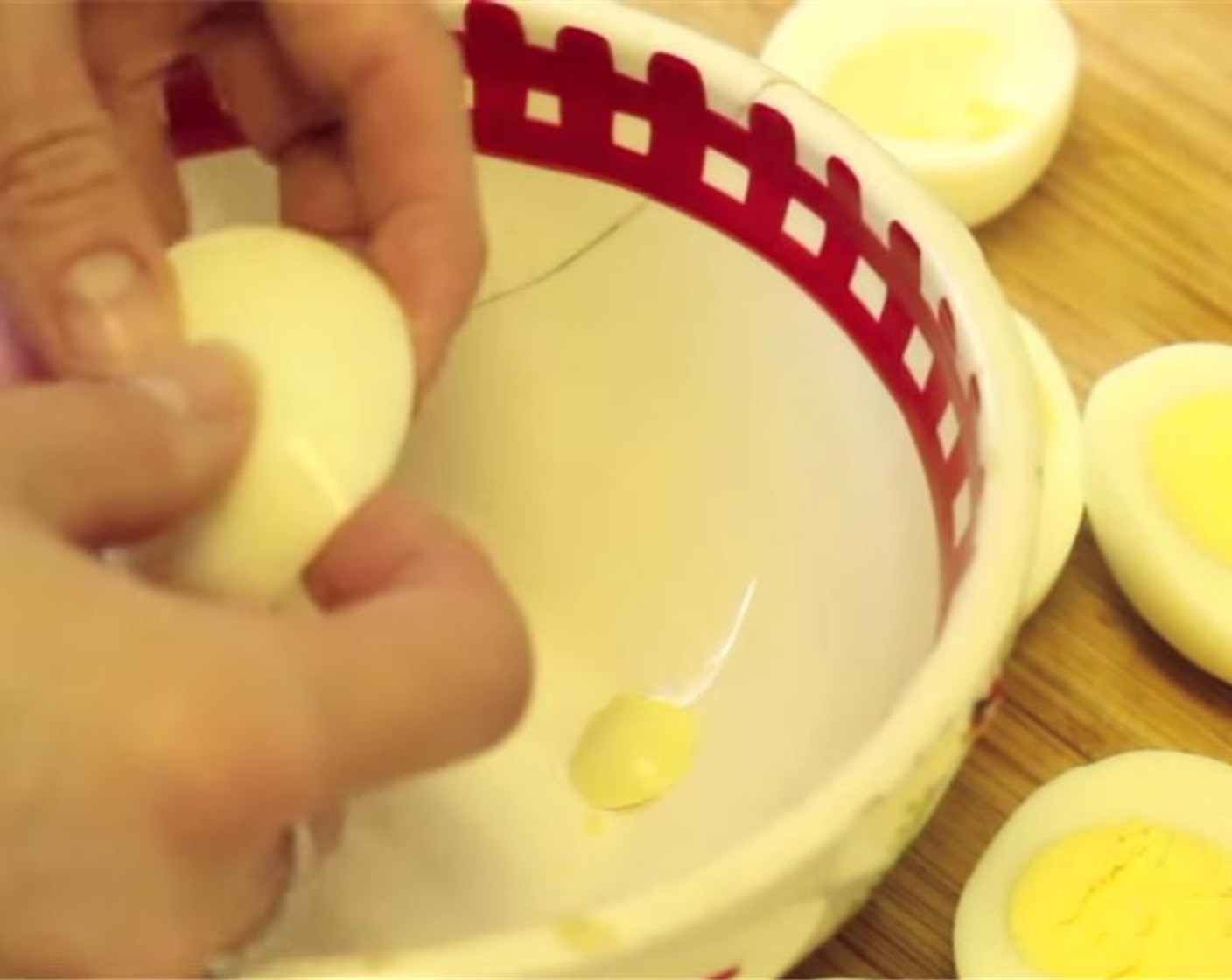 step 2 Slice eggs lengthwise, remove yolk, and place in a medium sized bowl.