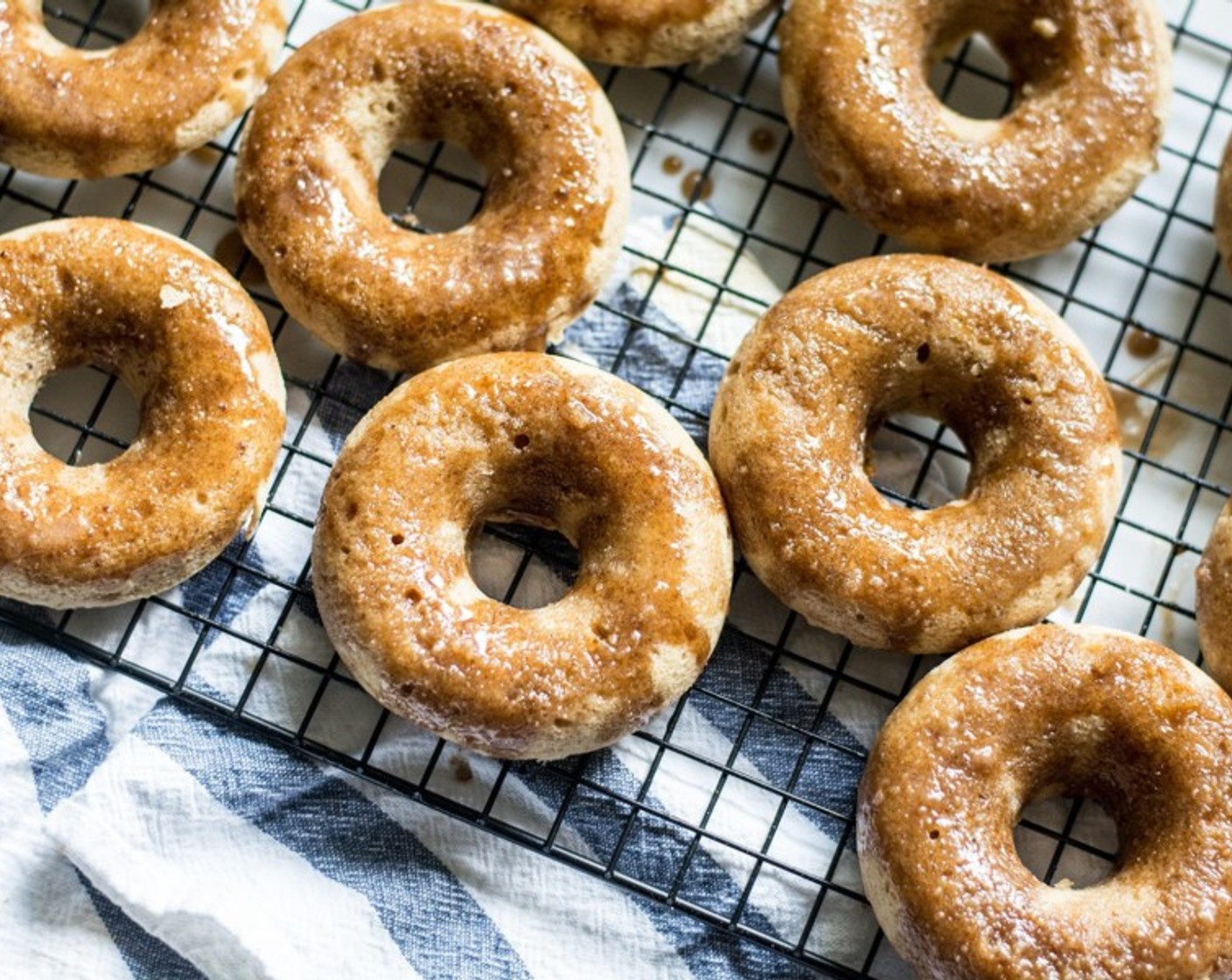 step 8 Carefully dip each donut in the slightly cooled glaze, or use spoon to drizzle over each one.