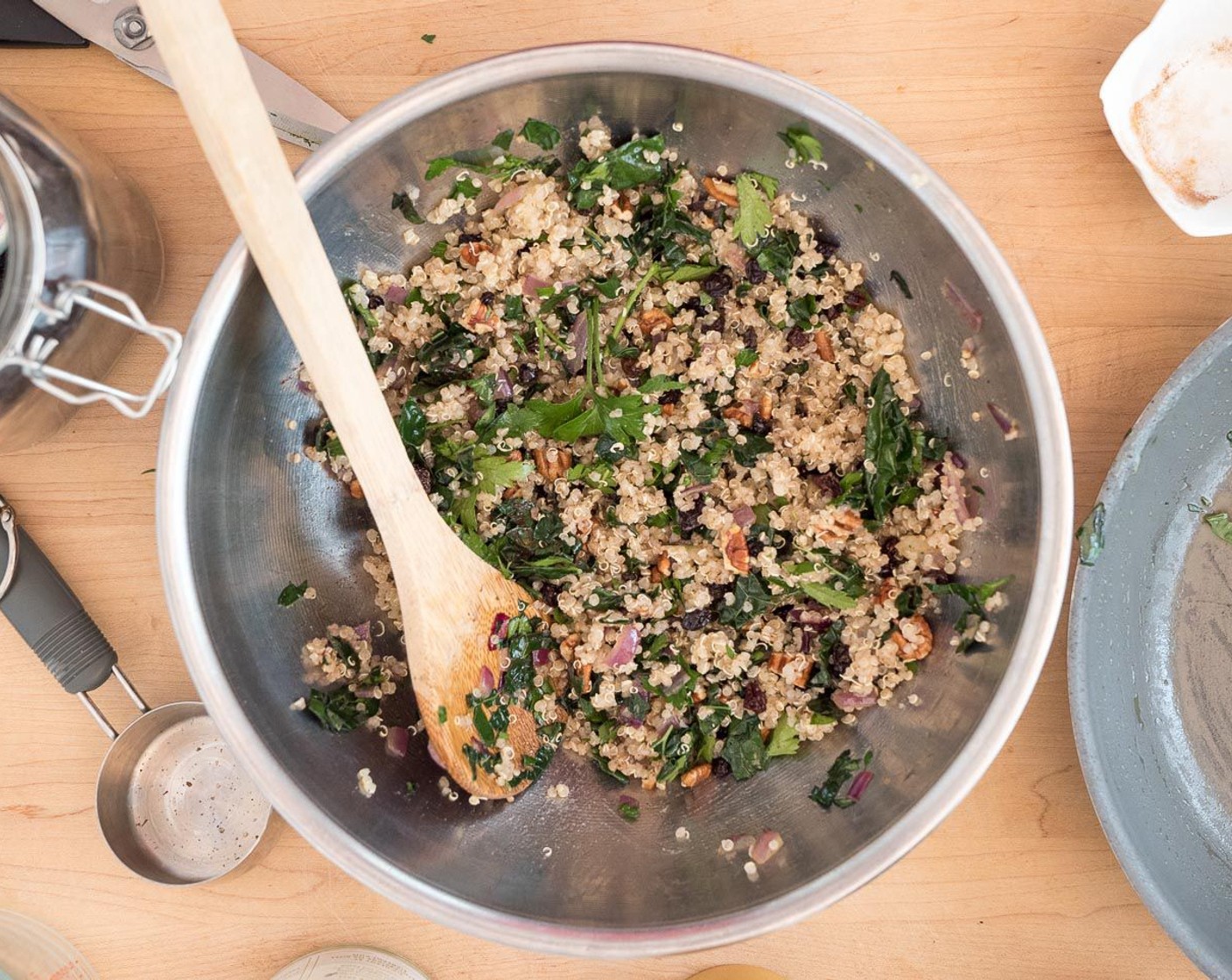 step 5 In a large bowl, combine the Quinoa (1 1/2 cups), sautéed Onions and Kale, Fresh Parsley (1 handful), Currants (1 Tbsp), Pecans (1/4 cup), Ground Cinnamon (1/2 tsp), and Ground Allspice (1/4 tsp). Drizzle with Extra-Virgin Olive Oil (1 Tbsp) and season with Sea Salt (to taste), and Ground Black Pepper (to taste).