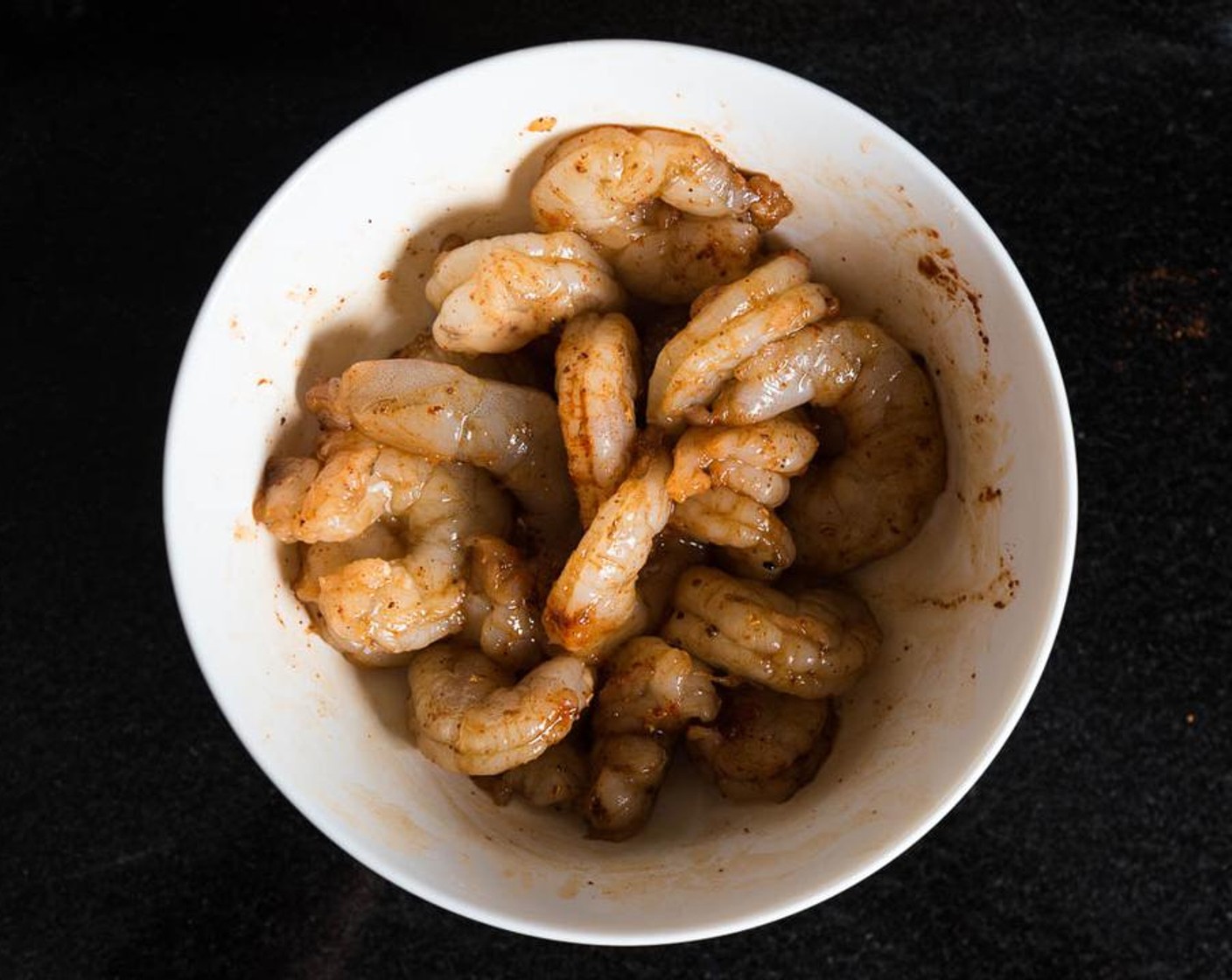 step 2 Mix well and coat shrimp evenly with spices. Let marinate for 10 to 30 minutes.