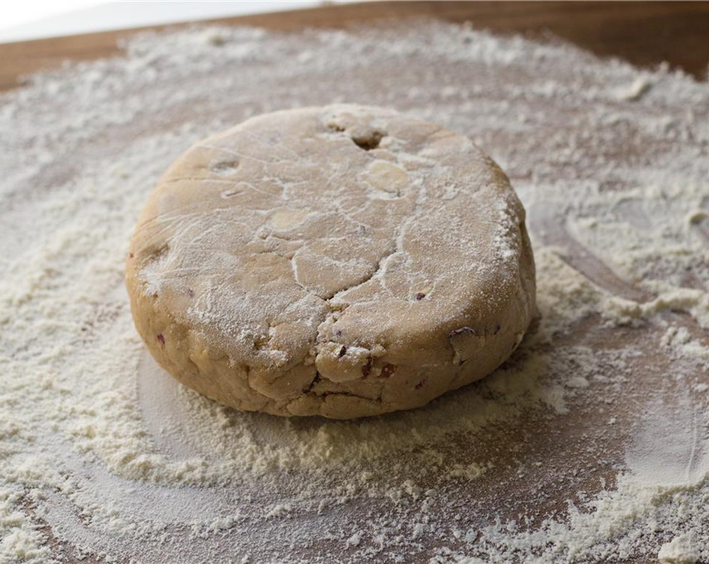 step 6 Preheat your oven to 350 degrees F (180 degrees C), and place oven racks in the top and bottom thirds of the oven. Line Baking sheets with parchment paper. Remove dough from plastic wrap and place on a lightly floured surface.