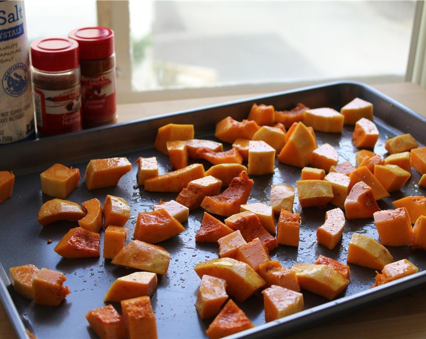 step 3 Place the cubed squash on a baking sheet. Drizzle with 2 tbsp. Olive Oil (2 Tbsp) and toss with ½ tsp. Kosher Salt (to taste) ¼ tsp. Cayenne Pepper (1/4 tsp), and ¼ tsp. Ground Nutmeg (1/4 tsp).  Roast in the oven for 30 minutes, or until the squash is golden brown, tossing halfway through.