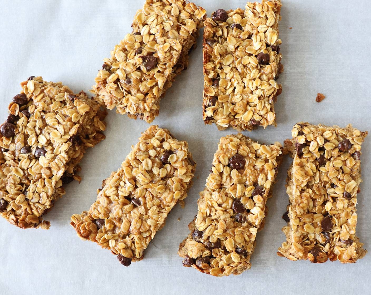 step 4 Spread the batter into a parchment paper lined 9 x 9 inch baking sheet. Bake the granola bars for 15-17 minutes until the sides are brown.