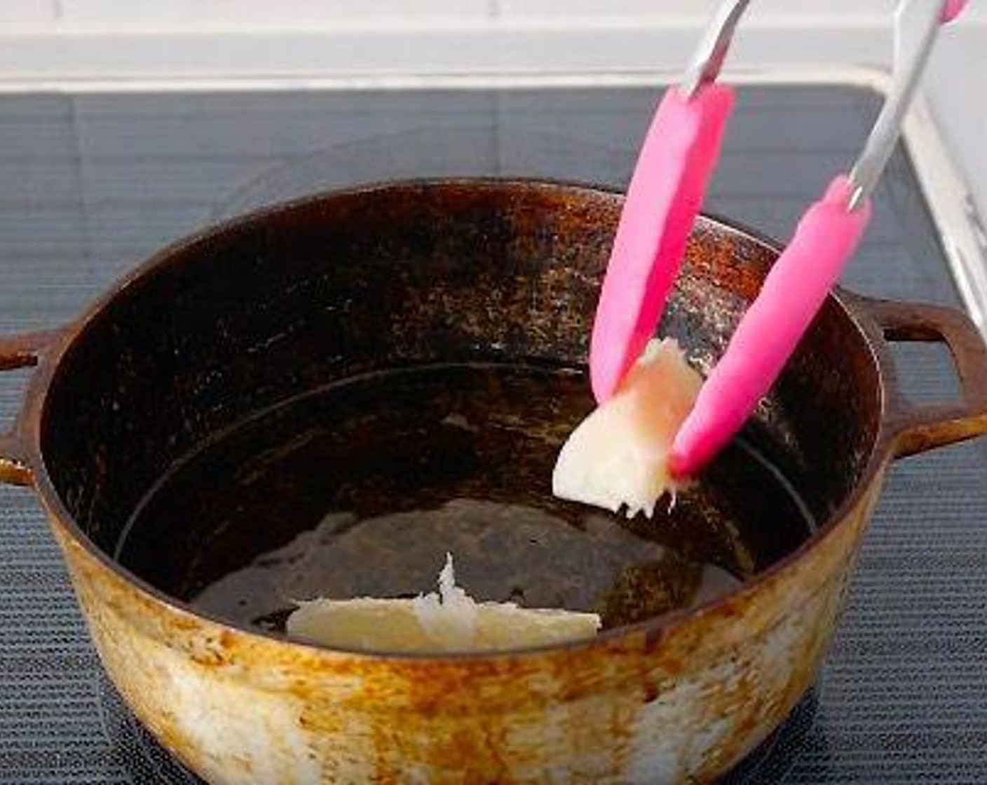 step 5 Add the dried cassava and fry until golden brown.