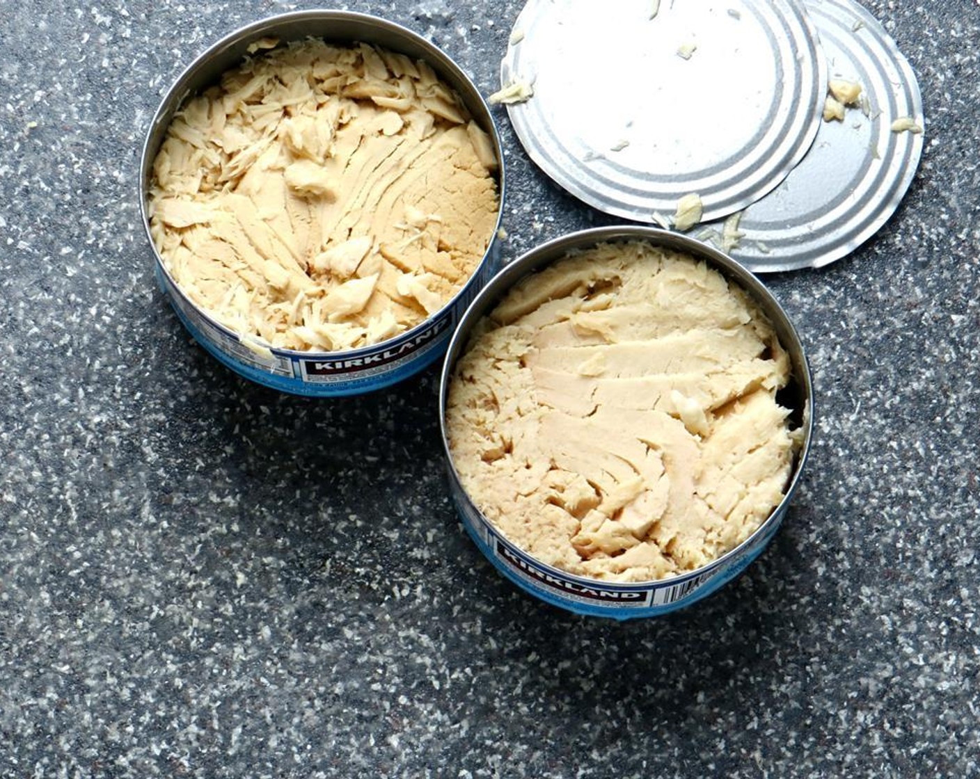 step 8 Drain the  Canned Tuna (2 cans) and flake the tuna.