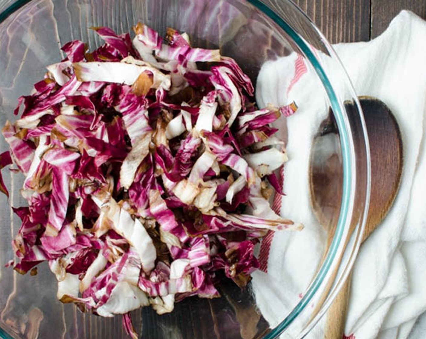 step 4 Remove from grill and cut away the core. Slice radicchio into 1/2" slices and transfer to a large bowl.
