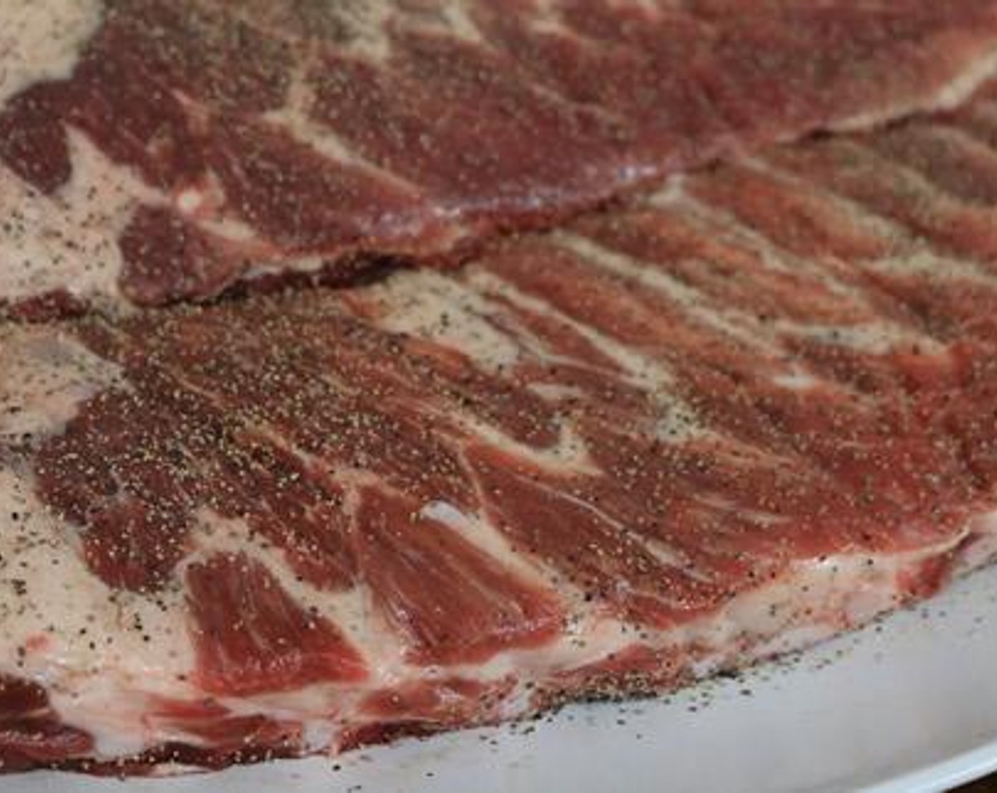 step 3 Combine Kosher Salt (4 Tbsp) and Freshly Ground Black Pepper (1/2 cup) in a bowl and pour into a shaker bottle. Season ribs liberally on both sides with salt and pepper mixture.
