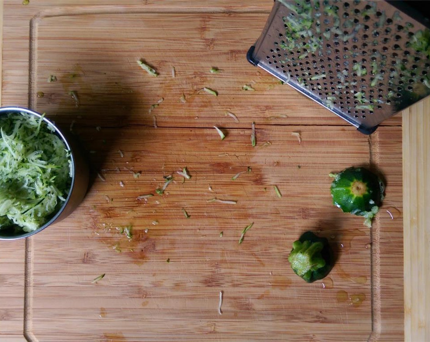 step 1 Using a grater, shred the Zucchini (1 cup). Place zucchini in a colander and press out as much moisture as you can. Set aside.