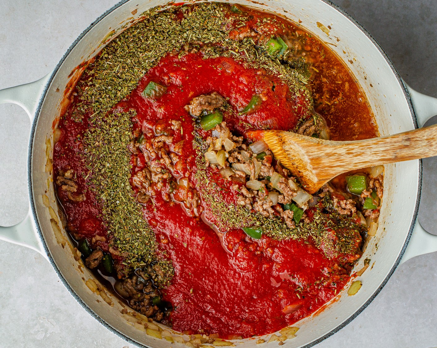 step 5 Add Garlic (4 cloves), Italian Seasoning (1 Tbsp), Seasoned Salt (1/2 Tbsp), Tomato Sauce (1 can), Crushed Tomatoes (1 can), Ground Black Pepper (1 tsp), and Granulated Sugar (1/2 Tbsp). Cook for 6 minutes until the sauce begins to bubble. Taste and adjust seasoning.