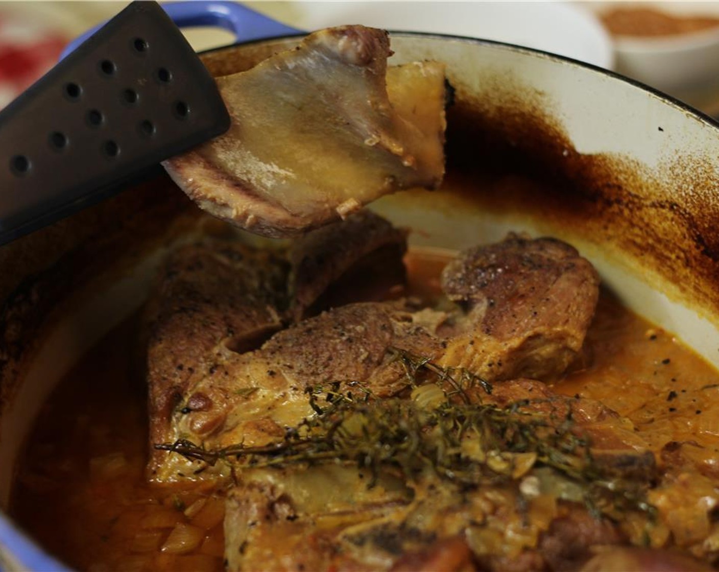 step 14 When the pork shoulder is finished, the bone will just fall out. Carefully remove the pork from the pan, and place it on a large plate. Tent aluminum over the plate, and let the pork rest for 15 to 20 minutes.