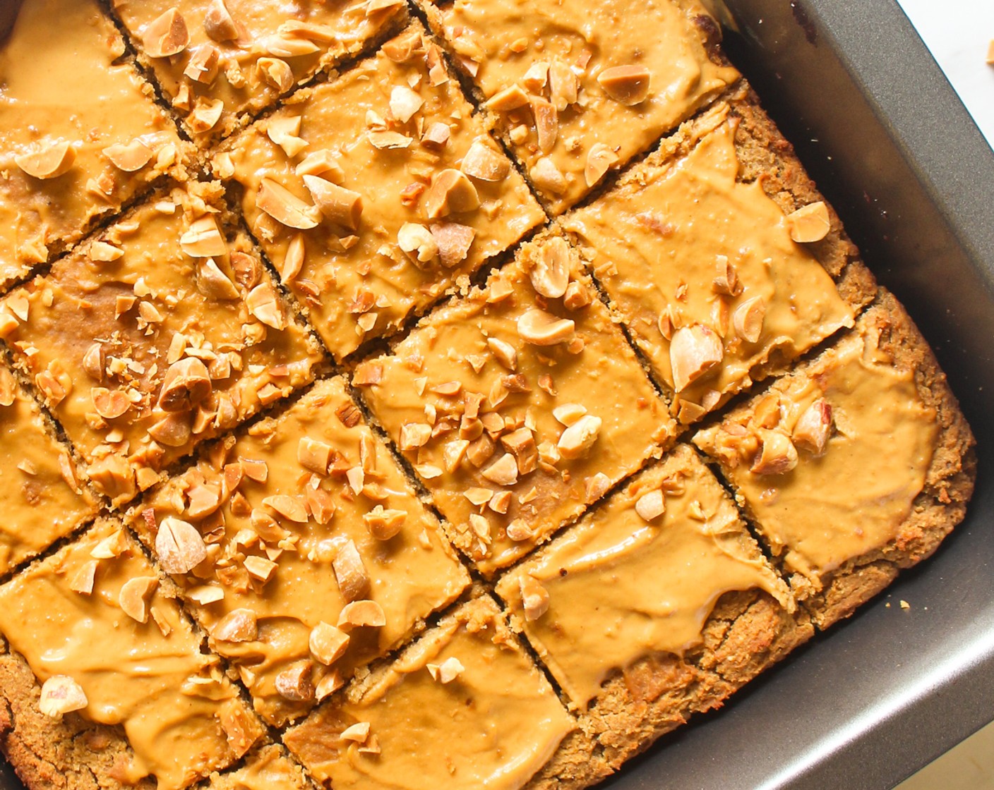 step 8 When the blondies are cooled to room temperature, spread the Peanut Butter (to taste) and top it with Peanuts (1 handful), if using. Slice and serve.