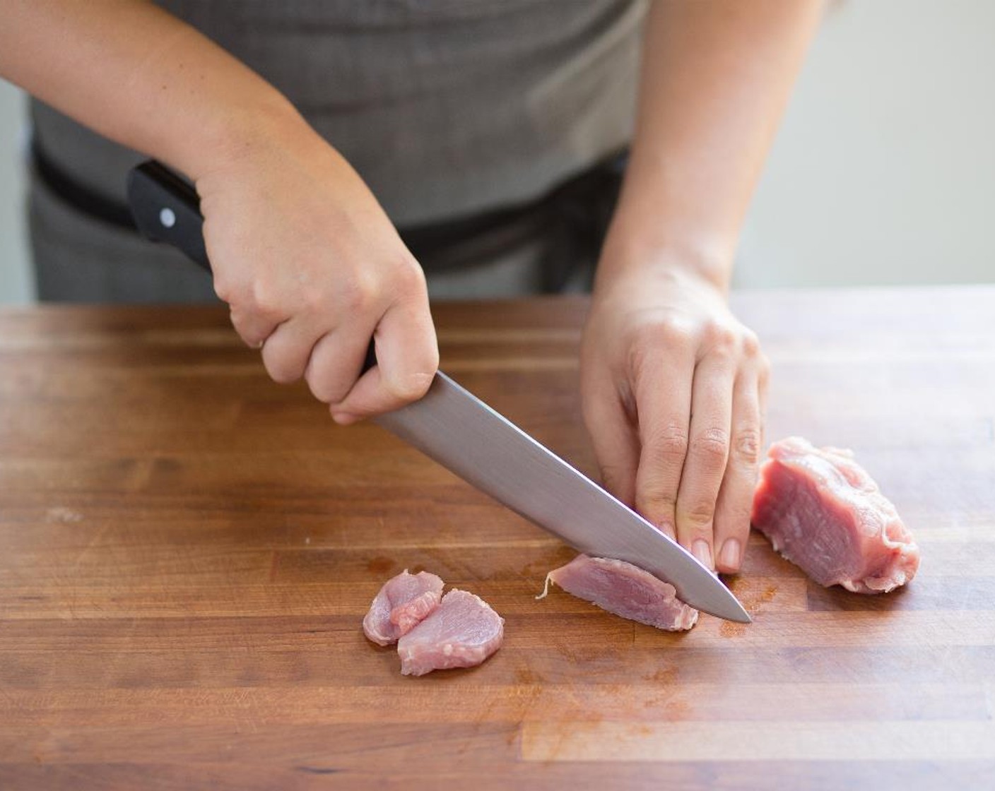 step 9 Pat dry the Pork Tenderloin (8 oz) with paper towels. Slice the pork tenderloin in half lengthwise, then cut each half into 1/4 inch sliced pieces; set aside.