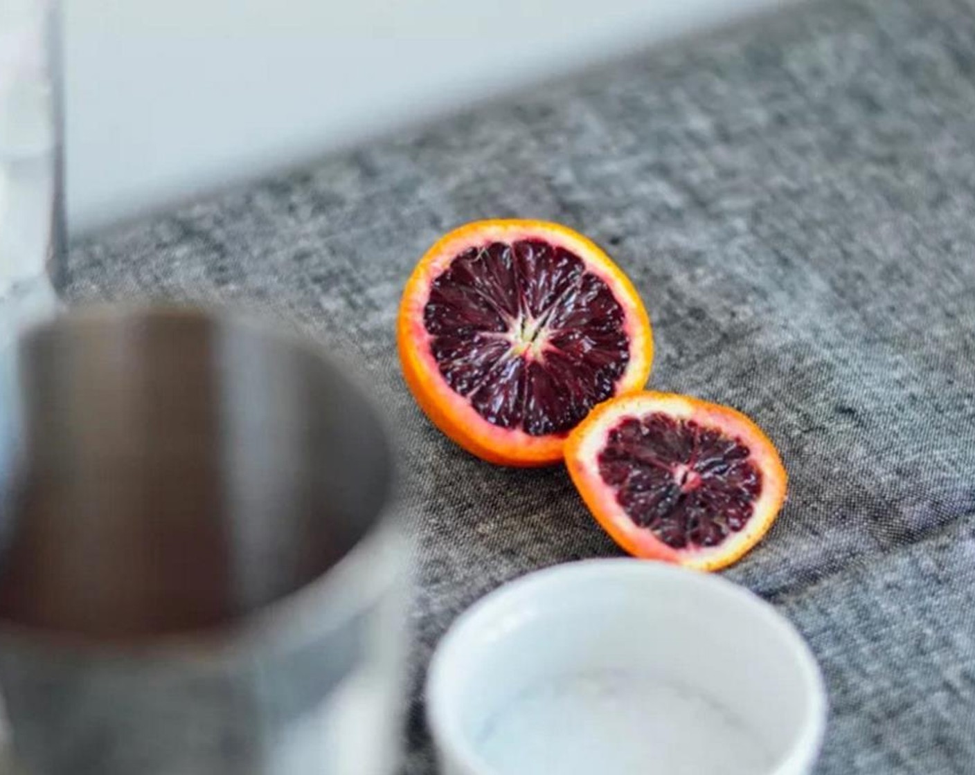 step 2 Rub half of glass rim with a slice of Blood Orange Syrup (3 Tbsp). Dip in Salt (to taste).