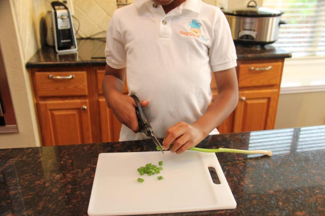 Step 1 of Slow Cooker Southwest Chicken Recipe: Chop and dice Fresh Cilantro (1/4 cup), Scallion (3 stalk) and Tomato (2).