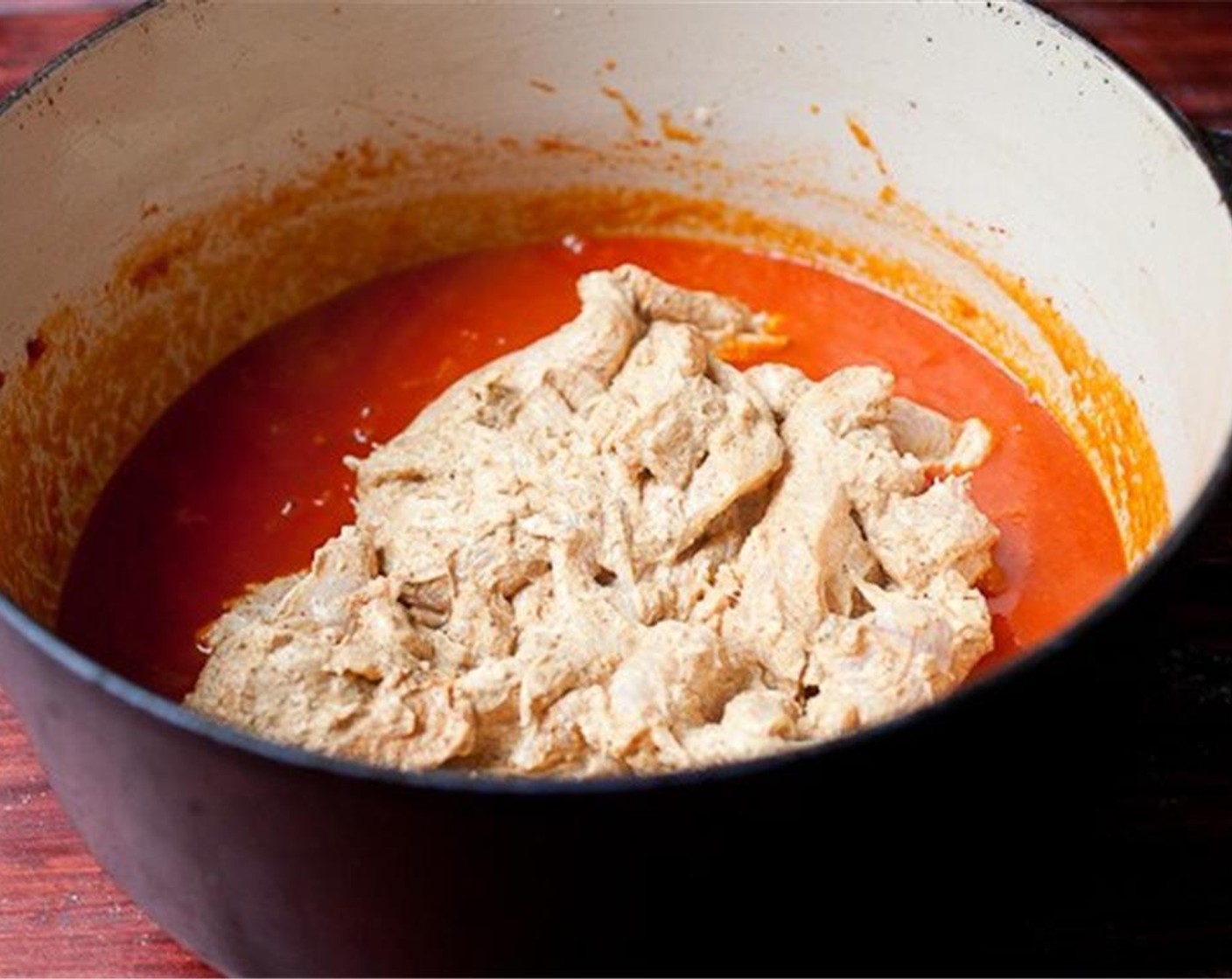 step 4 Add the marinated chicken into the pot along with the marinade. Stir everything together and bring the mixture to a low simmer. Let the mixture simmer, uncovered for 10 minutes, stirring it occasionally