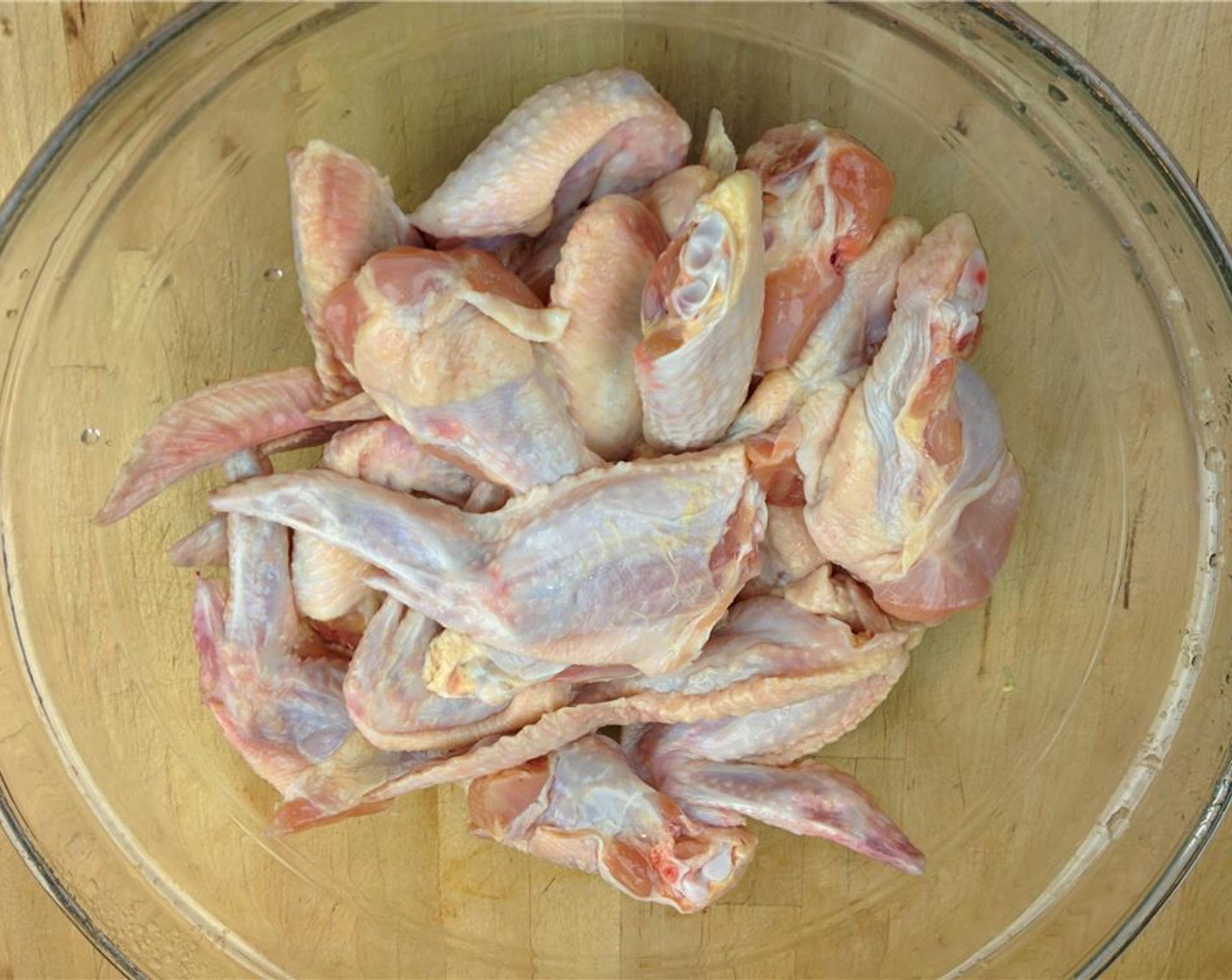 step 5 While the marinade is in the refrigerator, unpack, clean and thoroughly rinse Chicken Wings (3 lb) removing any stray feathers. After chicken has been rinsed, pat the pieces dry using a paper towel.