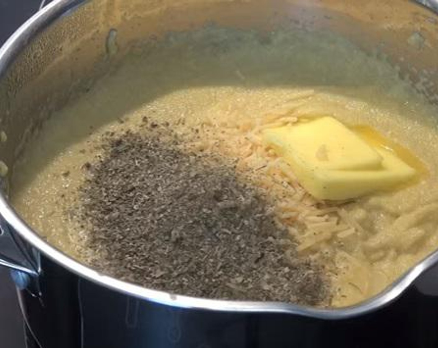 step 3 Turn off the heat and add the Parmesan Cheese (4 Tbsp), Butter (2 Tbsp), juice from Lemon (1) and Dried Mixed Herbs (1 Tbsp). Stir quickly.