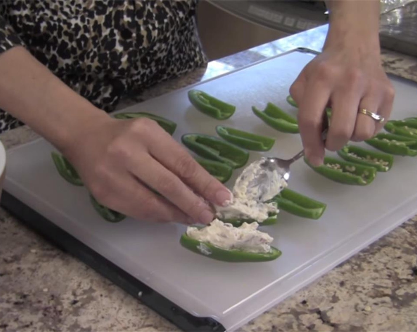 step 5 Using a spoon, mound the cream cheese mixture into the jalapenos pepper, and top with grated Cheddar Cheese (2 cups).