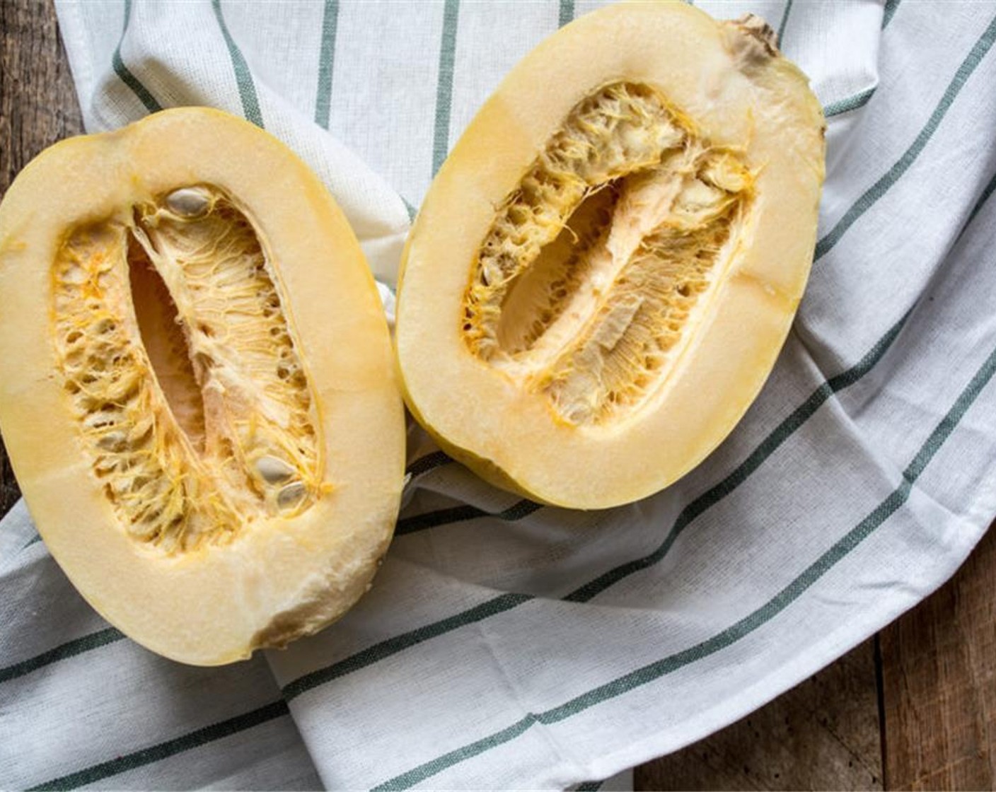 step 2 Cut Spaghetti Squash (1) in half lengthwise, remove seeds and cook on baking sheet for 50-55 minutes.