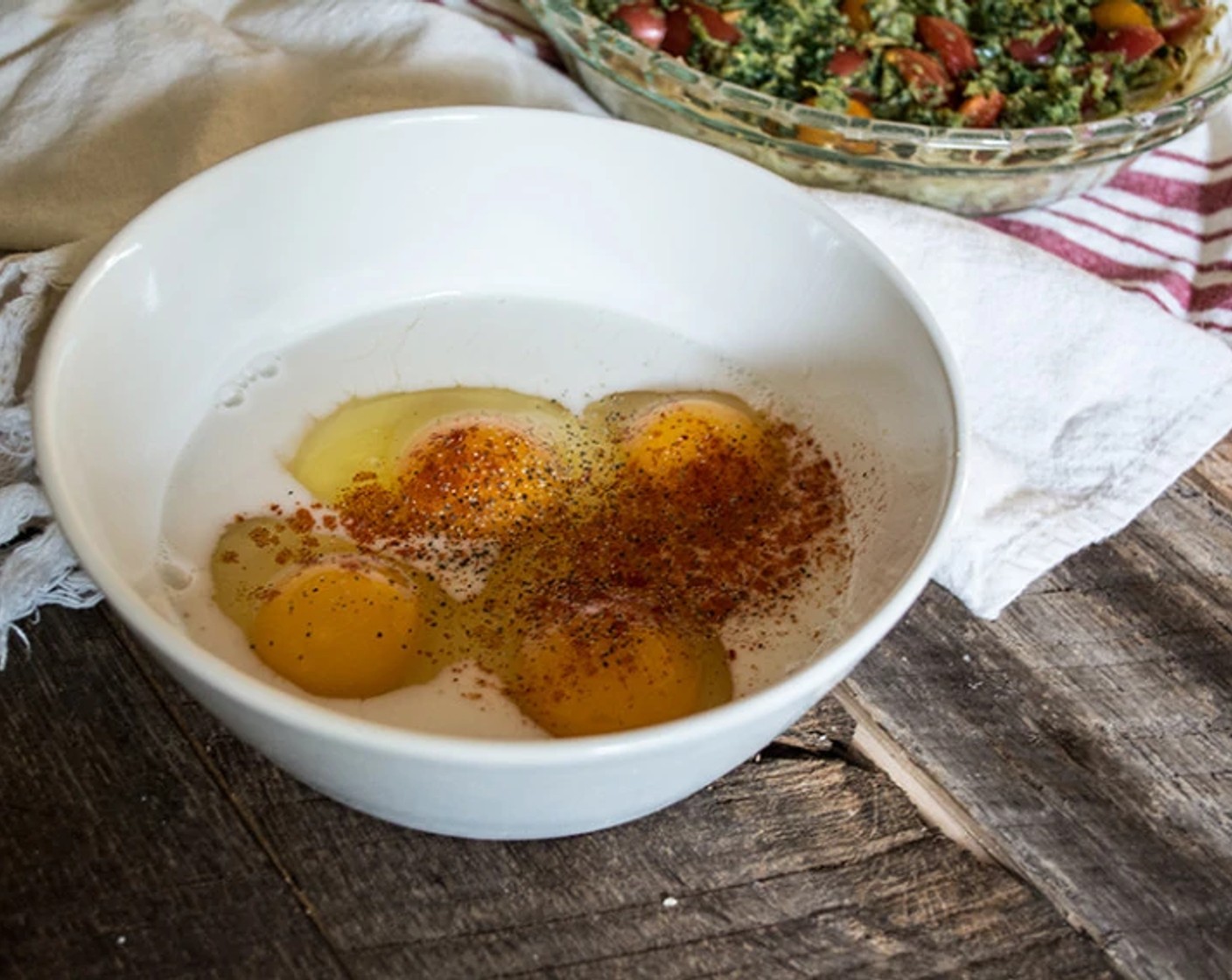 step 6 In a separate mixing bowl, whisk together Eggs (4), Almond Milk (1/4 cup), Smoked Paprika, and Ground Black Pepper until thoroughly combined.