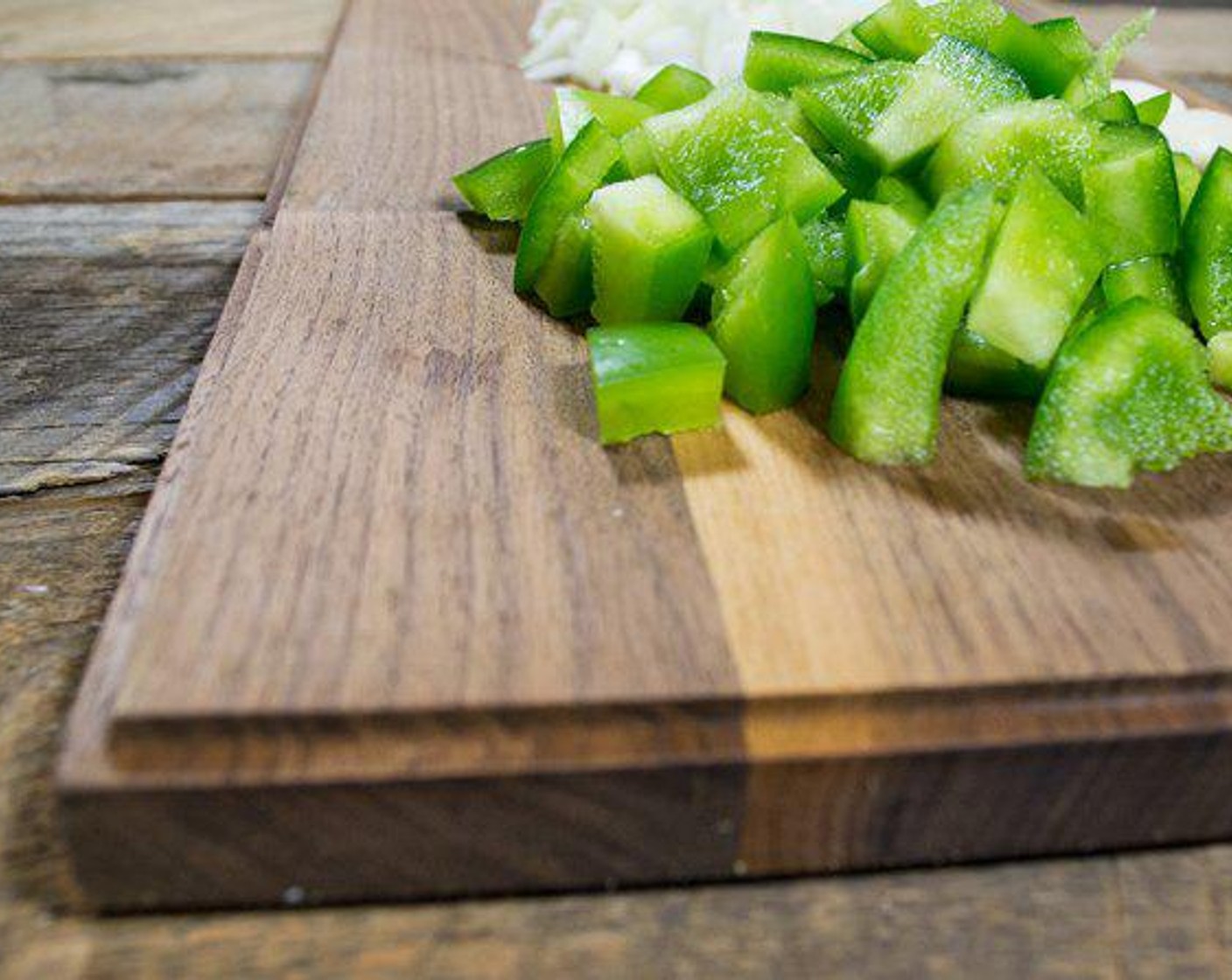 step 1 Add Sweet Onions (2), Green Bell Peppers (2), and Garlic (2 cloves) in a large pot spray with Coconut Oil Cooking Spray (as needed), and cook on medium heat for approximately 5-7 minutes.