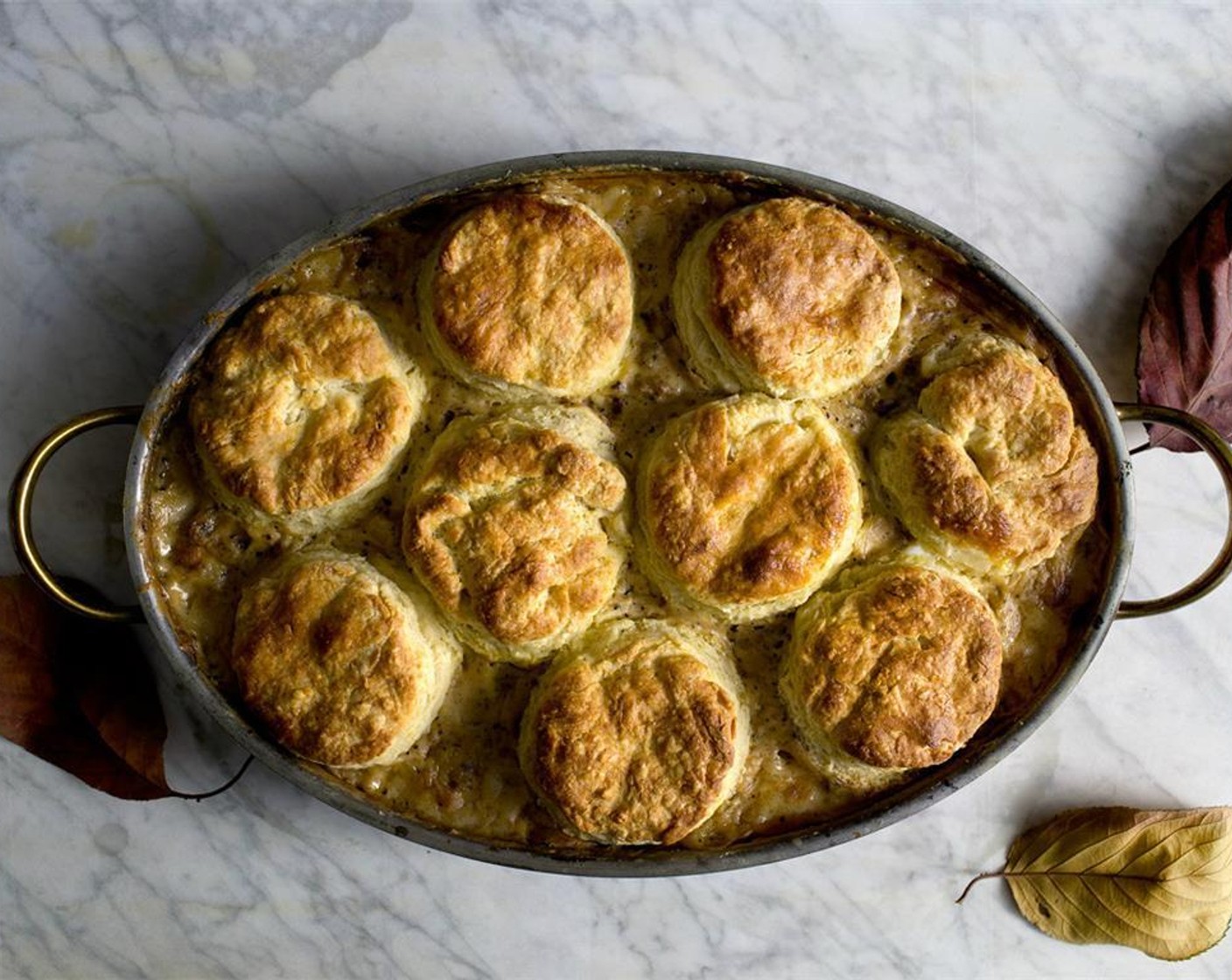 step 18 Then lower the heat down to 430 degrees F (220 degrees C), and bake for another 15 min until the biscuits are puffed and golden browned. If the biscuits are browning too fast before the end of 15 min, lower the heat down to 400 degrees F (200 degrees C).