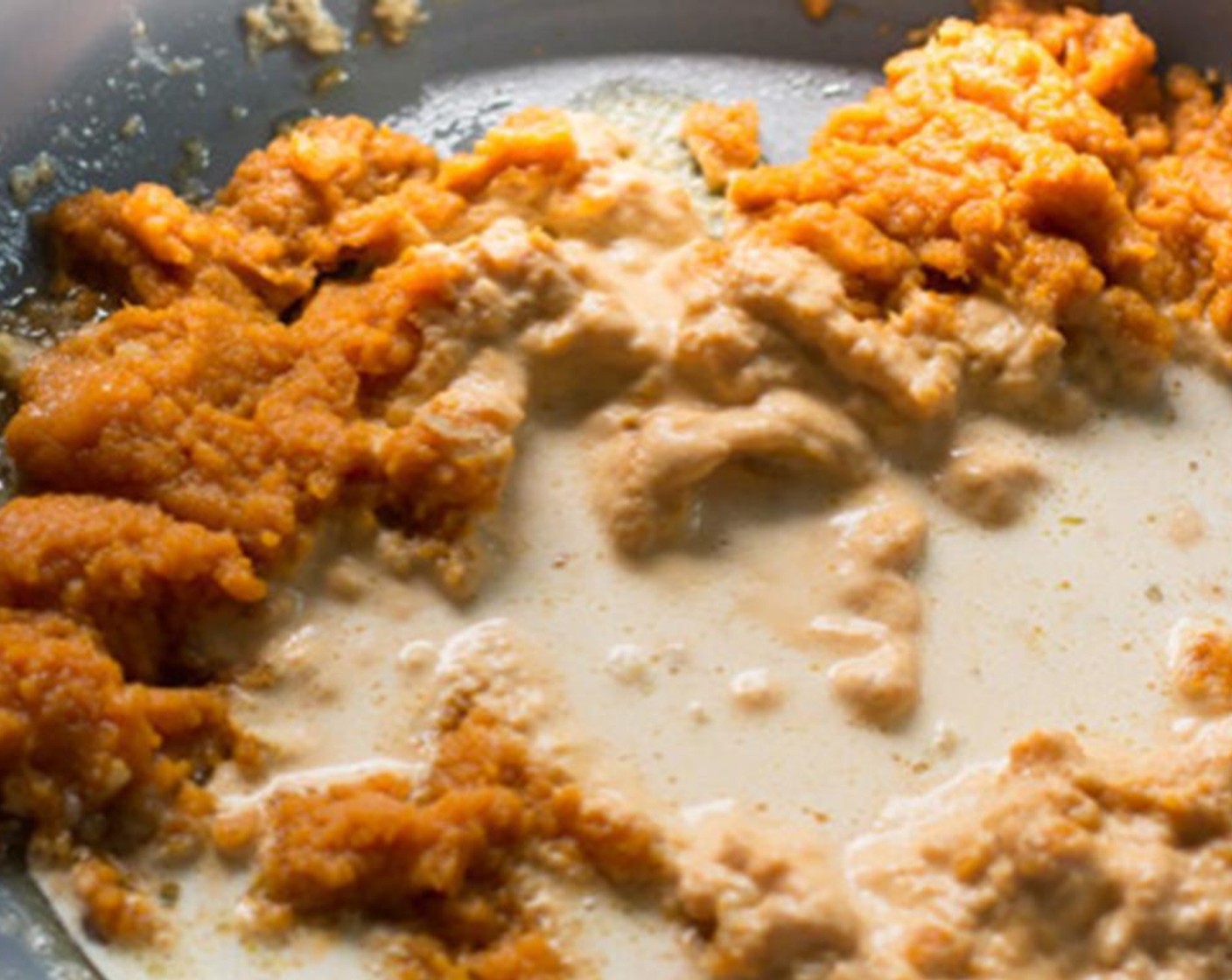 step 2 In a large skillet, melt Butter (2 Tbsp) over medium heat and cook Garlic (3 cloves) for about 30 seconds. Whisk in the Canned Pumpkin Purée (1 cup) and Half and Half (1 1/2 cups).