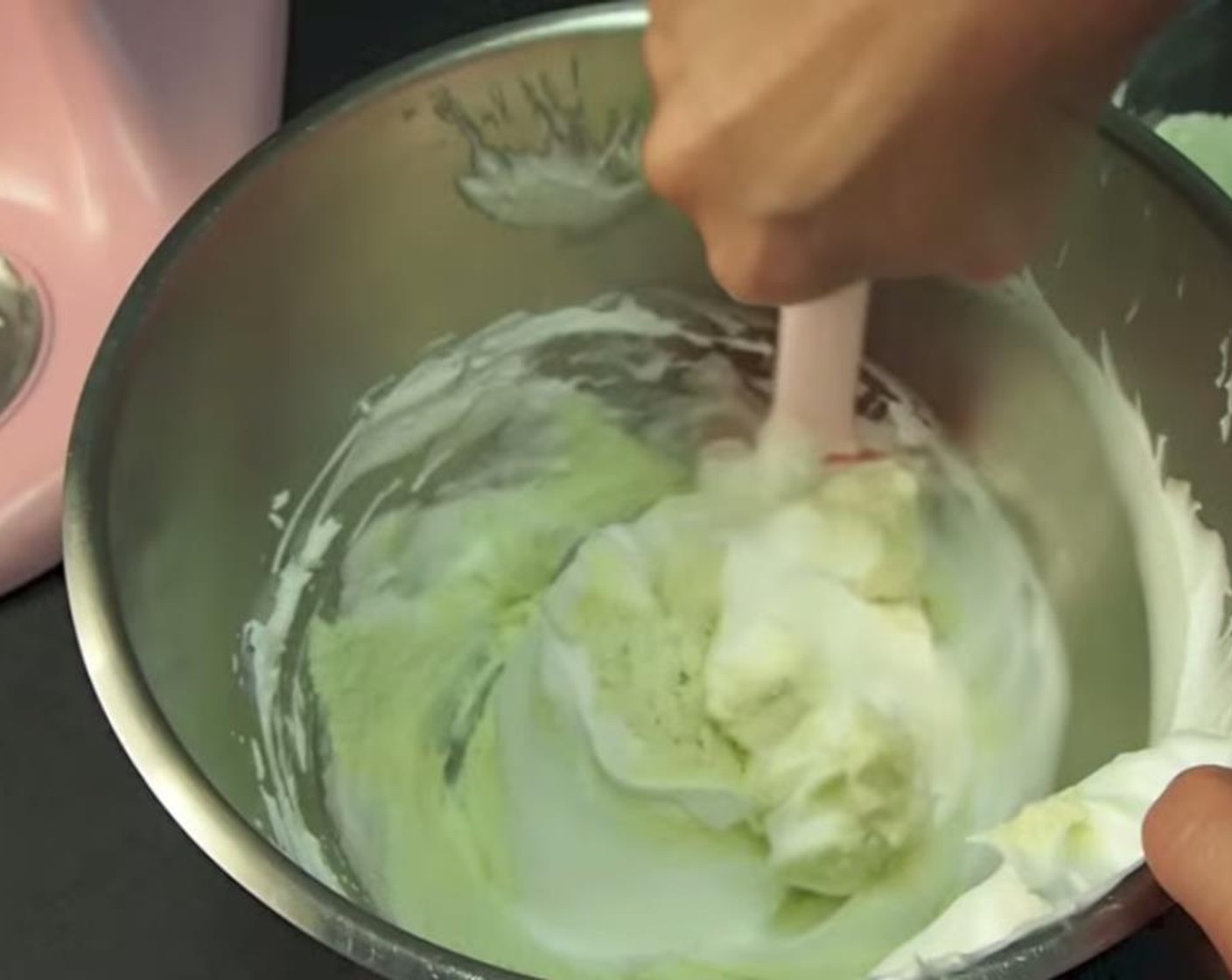 step 5 Using a spatula, slowly incorporate your meringue into your dry, sifted mixture.