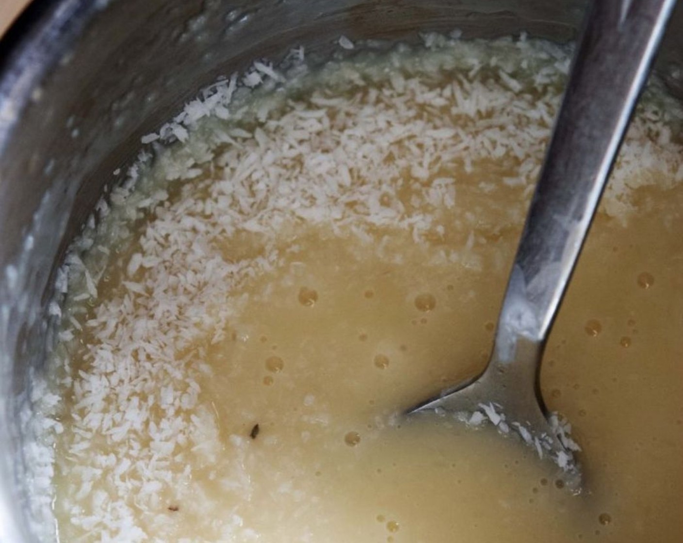 step 7 Add in the Sweetened Shredded Coconut (1/2 cup) and stir. Let the cream cool down.